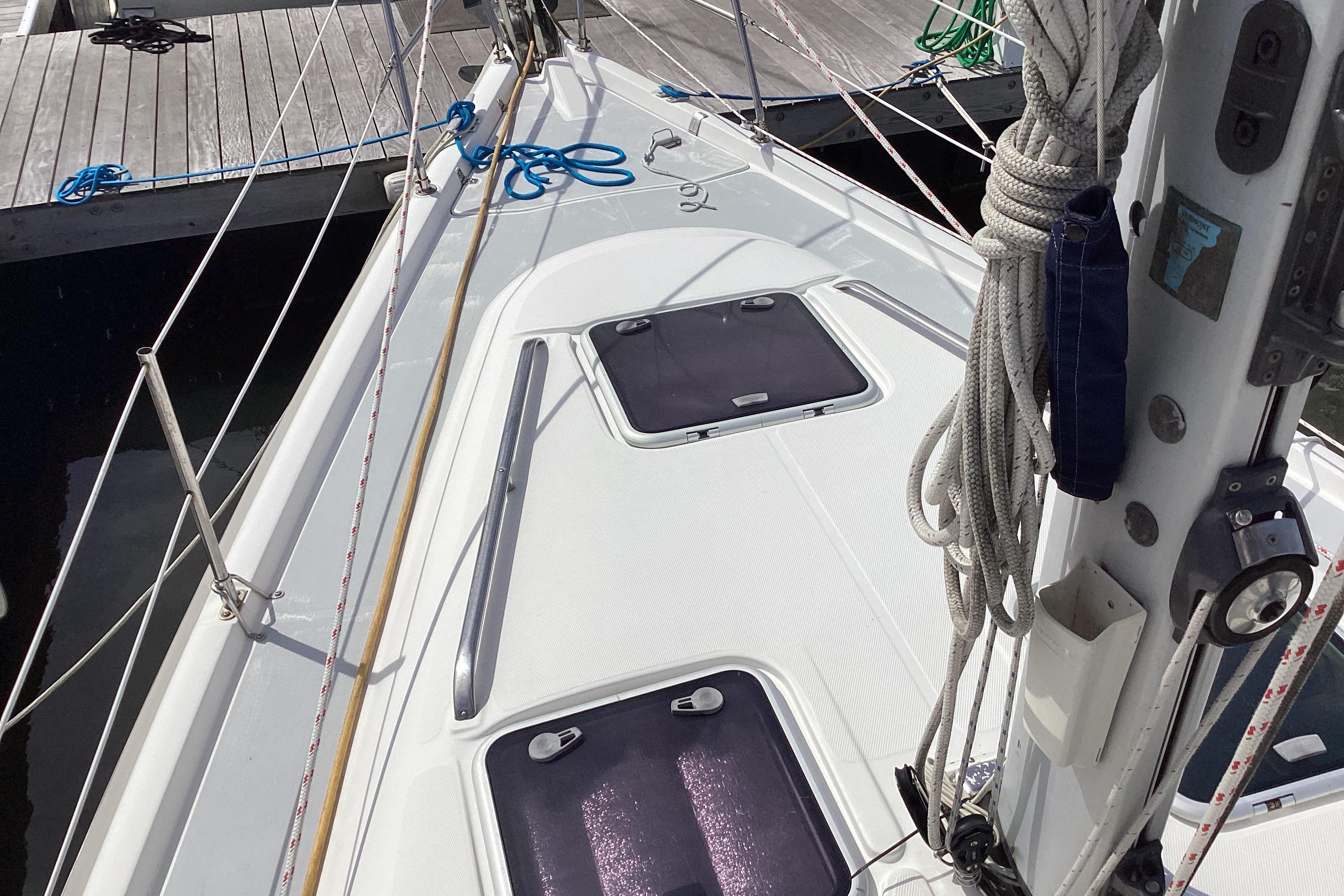 Deck view of a 2001 Hunter 380 sailboat docked at a marina.