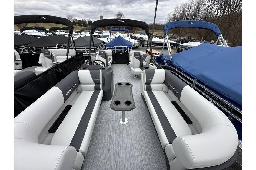 2026 Bennington 20 SSR Quad Bench Tritoon with Yamaha 115 HP, spacious seating, docked outdoors.