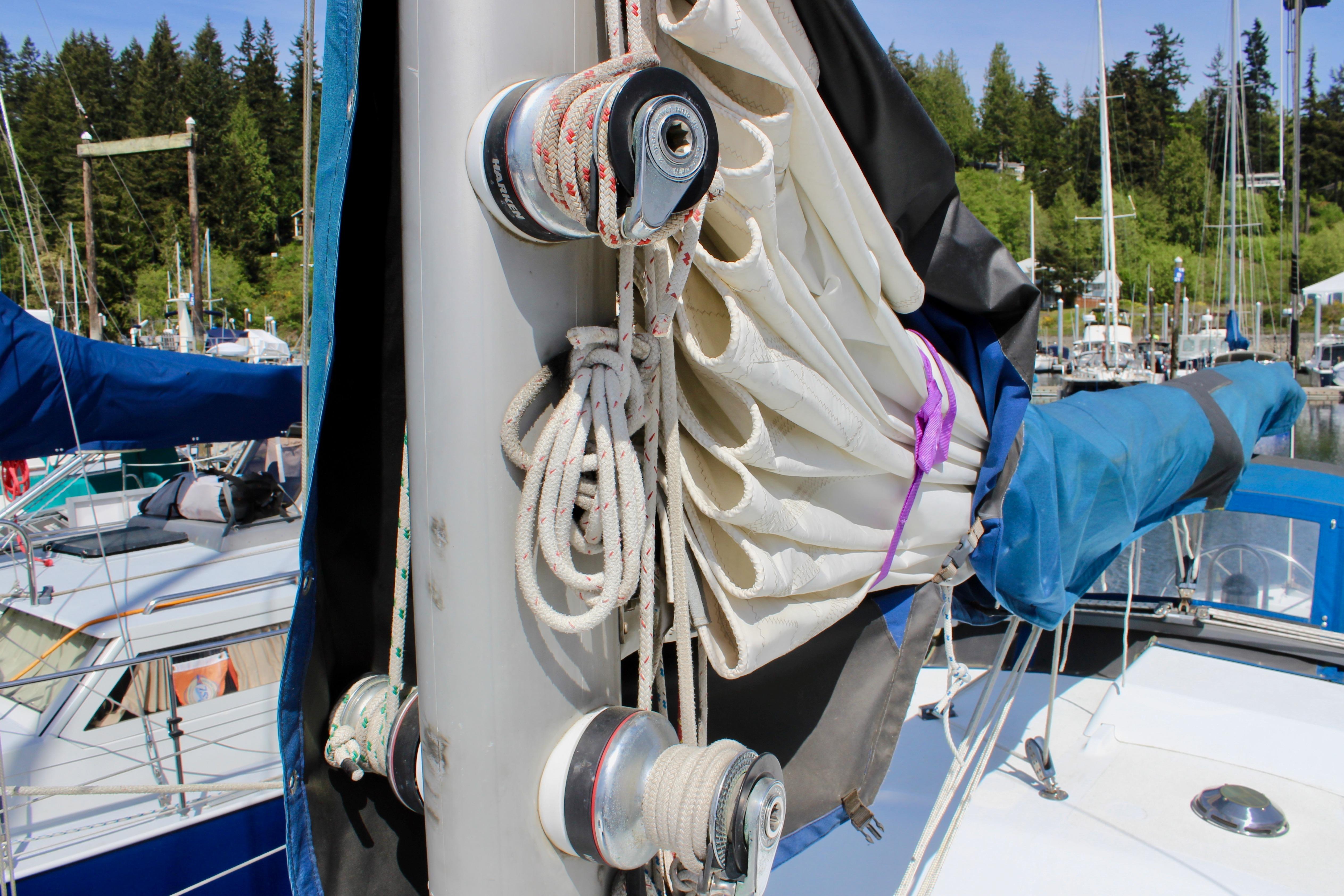 Sailboat mast with ropes and sails, Freya 39 model, 1993, docked in marina.