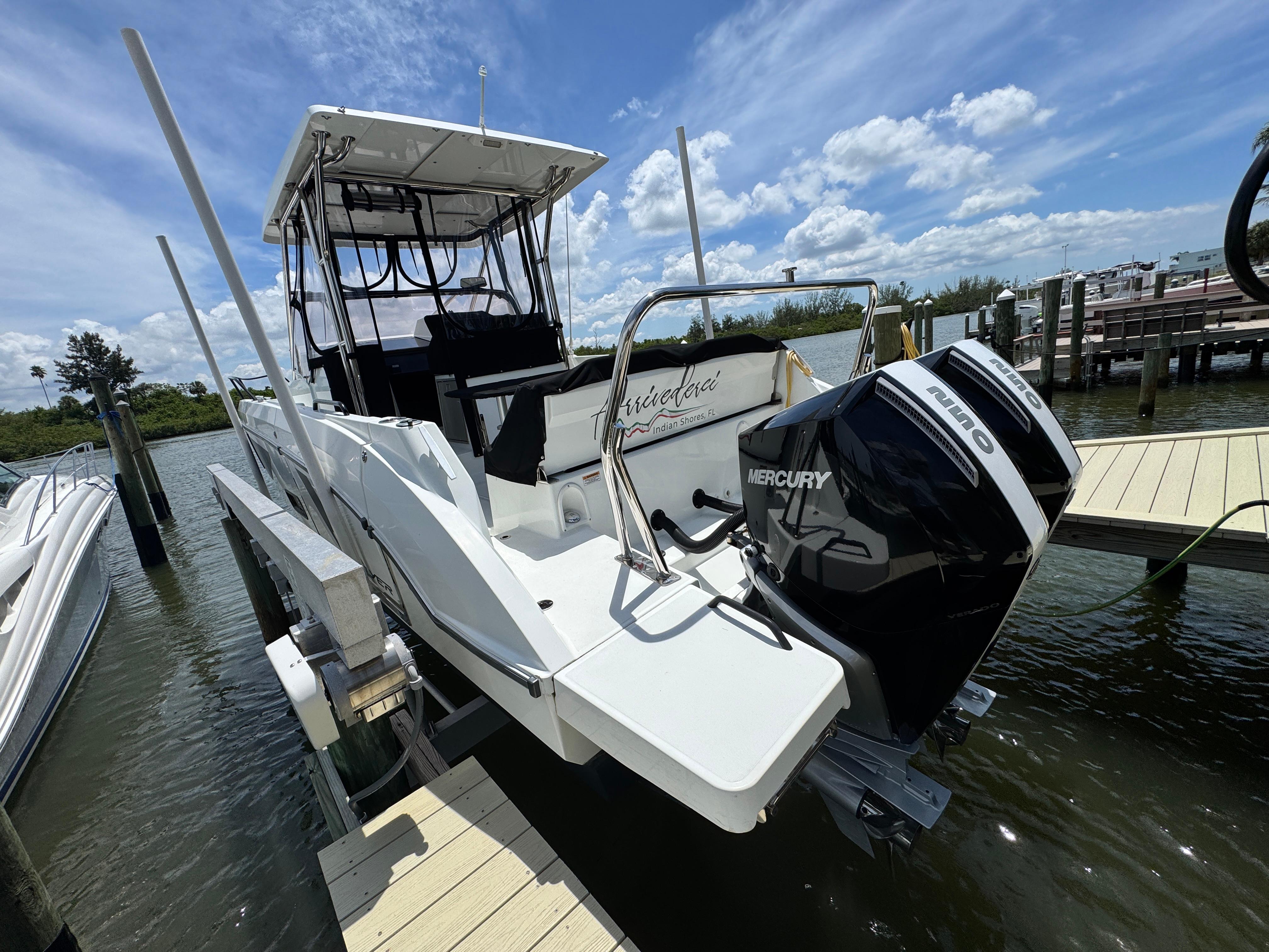 2022 Beneteau Flyer 9 SUNdeck docked, featuring dual Mercury outboard engines.