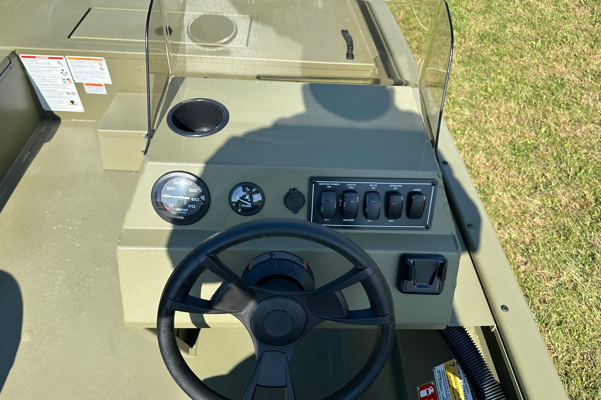 2026 Lowe Roughneck 1860SC boat console with steering wheel and control panel.