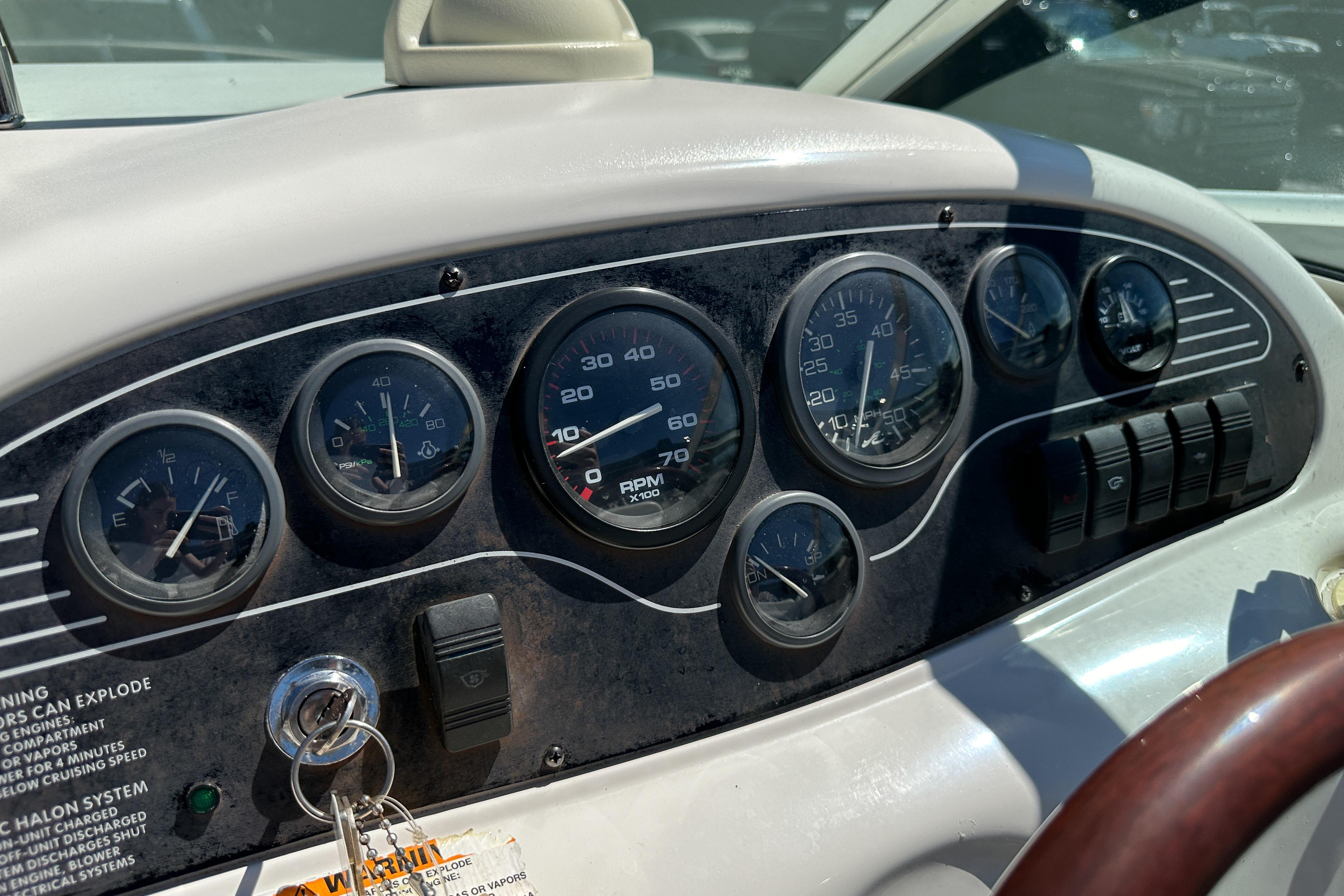 Dashboard of a 1998 Sea Ray 215 Express Cruiser with gauges and controls.