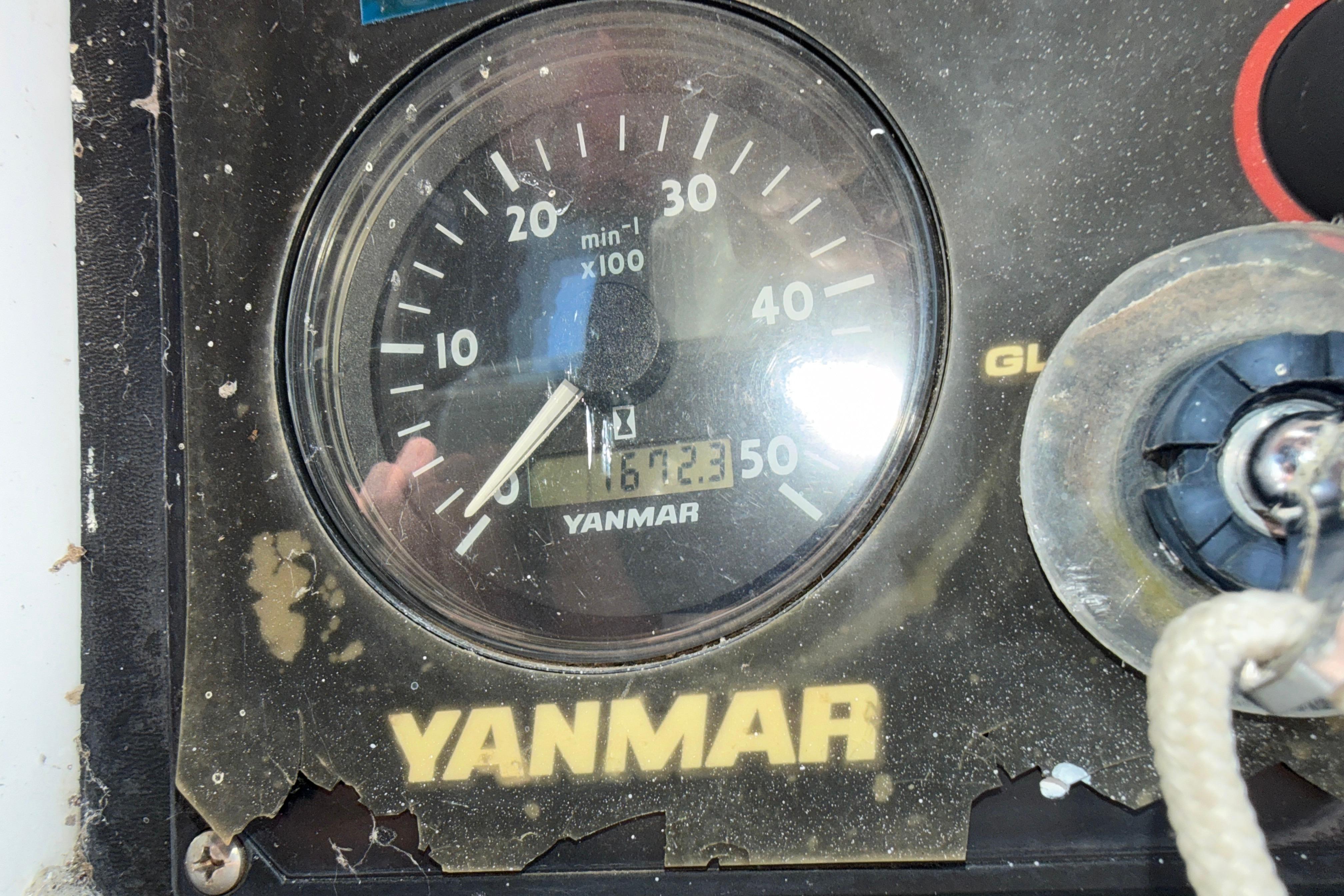 Yanmar engine gauge on a 2005 Hunter 38 sailboat, showing 1672.3 hours.