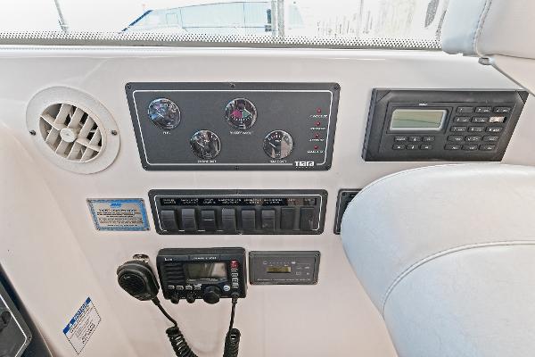 Control panel of a 2008 Tiara Yachts 4200 Open, featuring gauges and communication equipment.