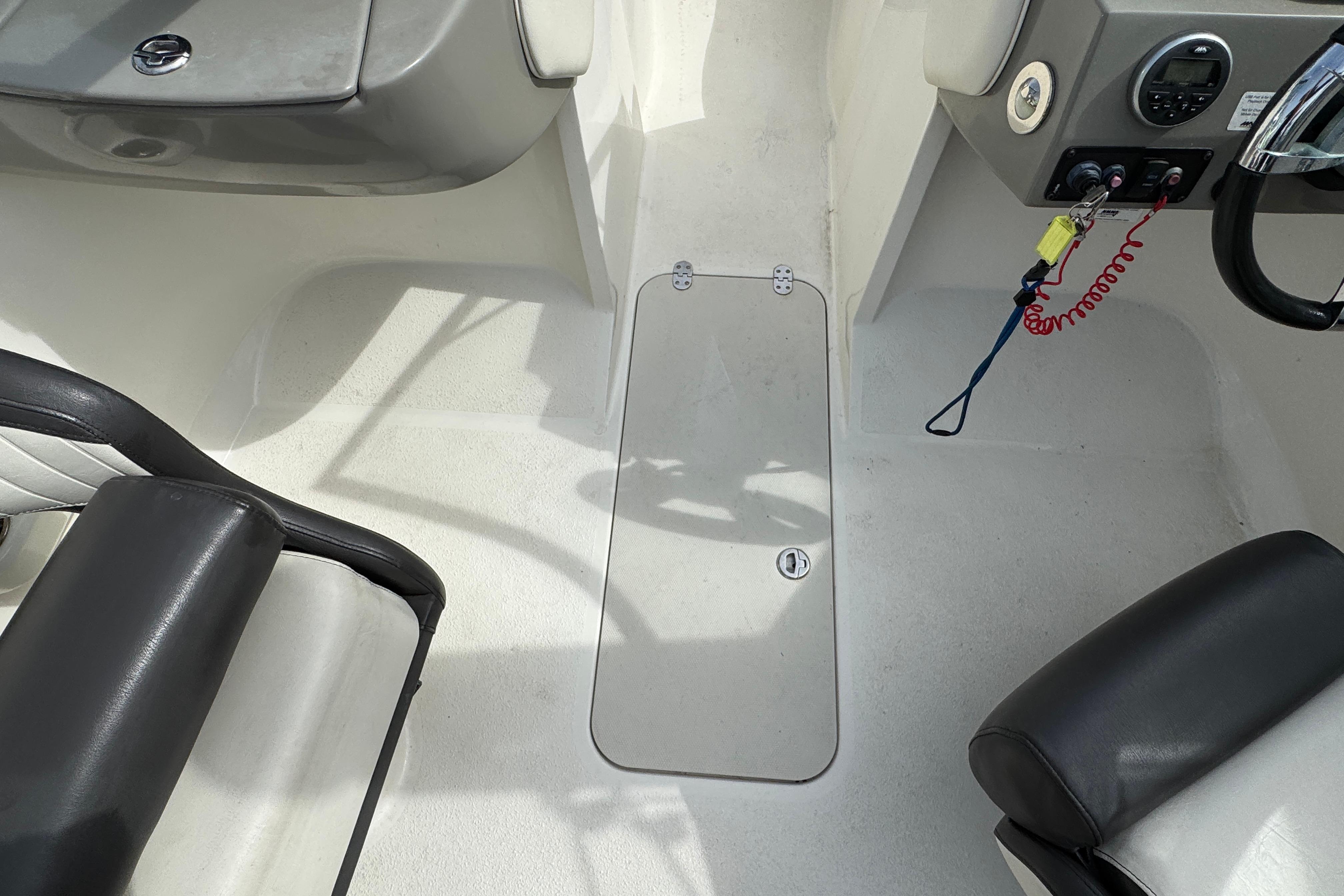 2018 Stingray 204 LR boat interior with seating and control panel.
