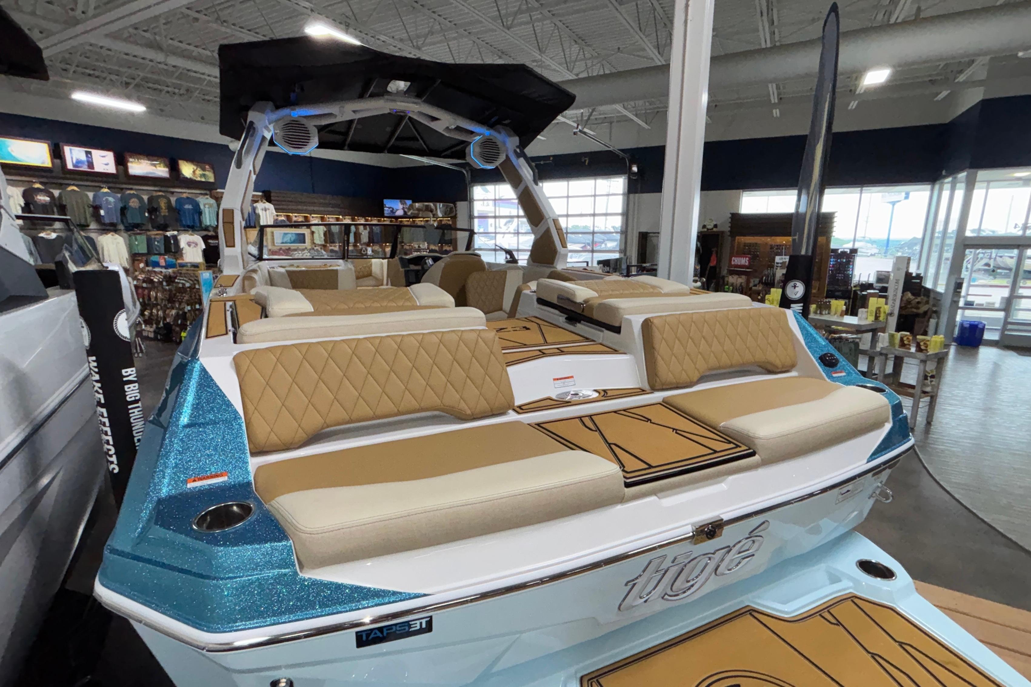 2026 Tigé Z3 boat with luxurious seating and modern design in showroom.