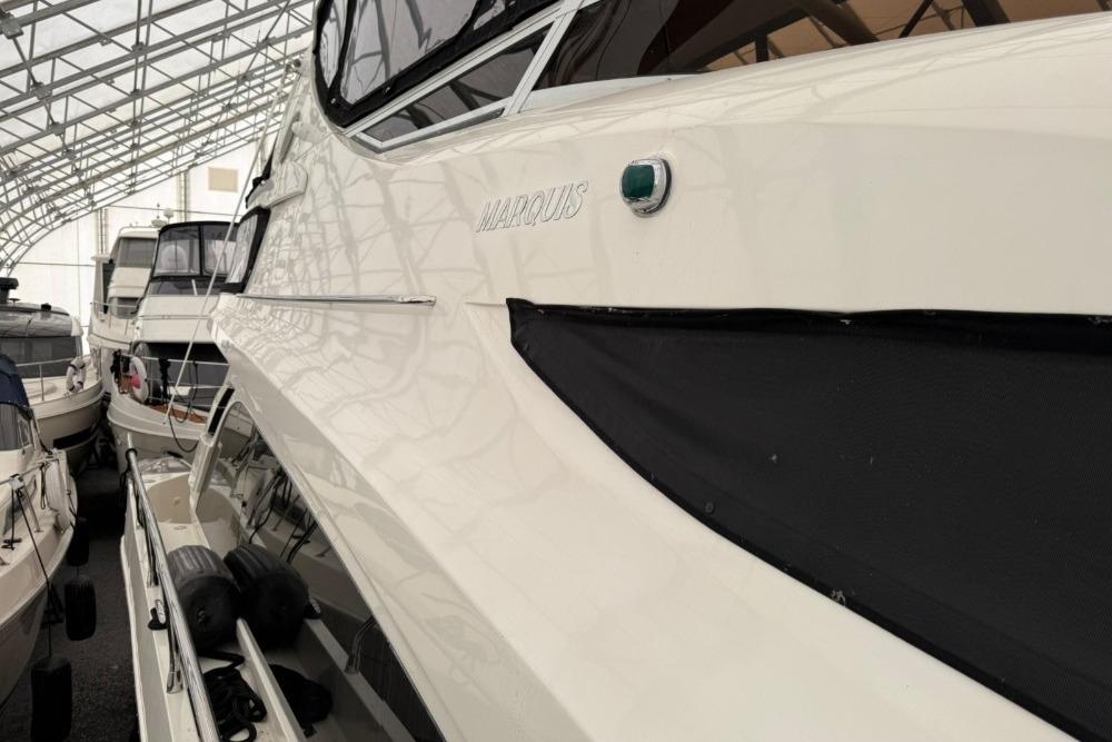 2007 Marquis 55 LS yacht in storage, showcasing sleek design and luxury features.