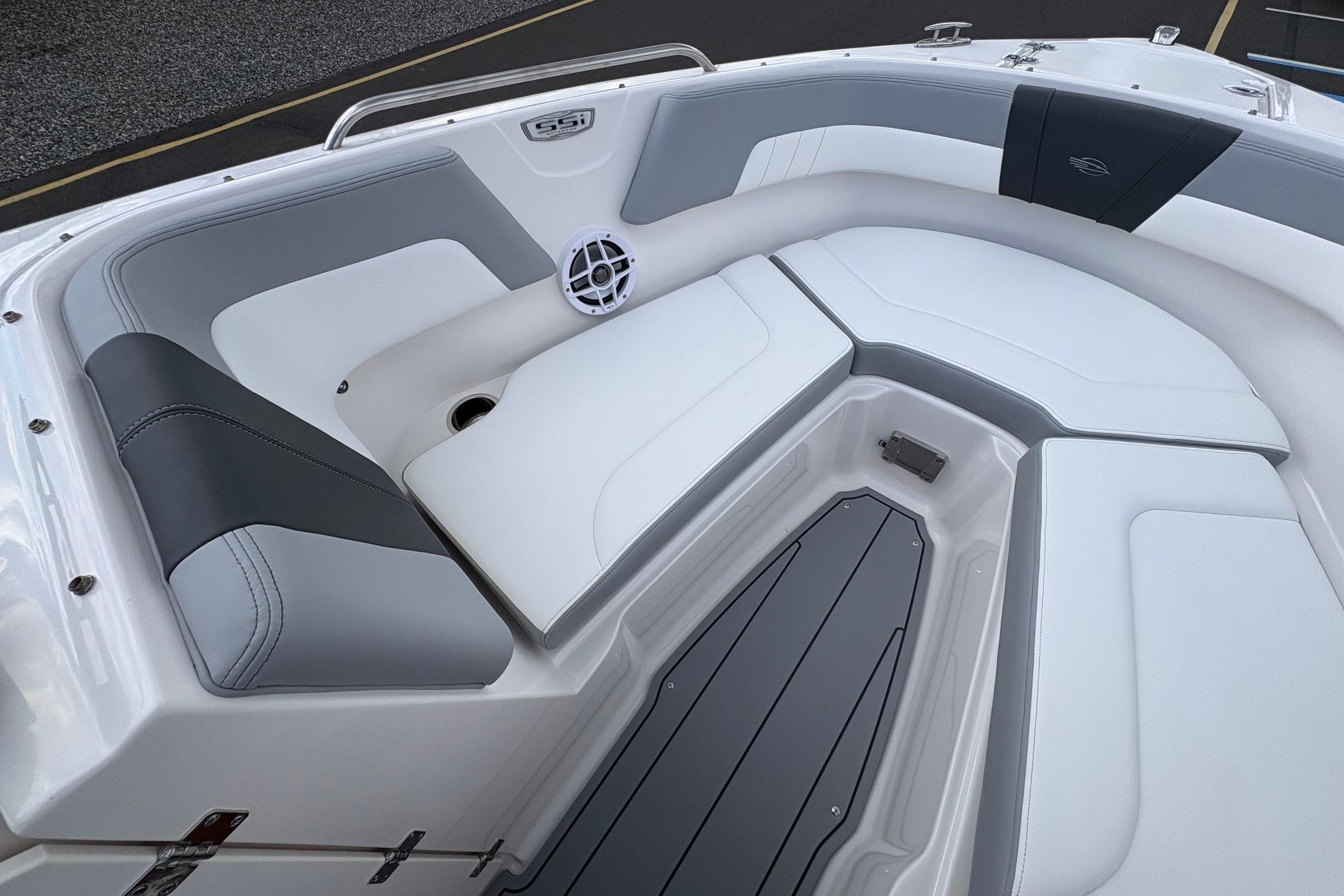 2026 Chaparral 23 SSi OB boat interior with sleek, modern seating and speaker system.