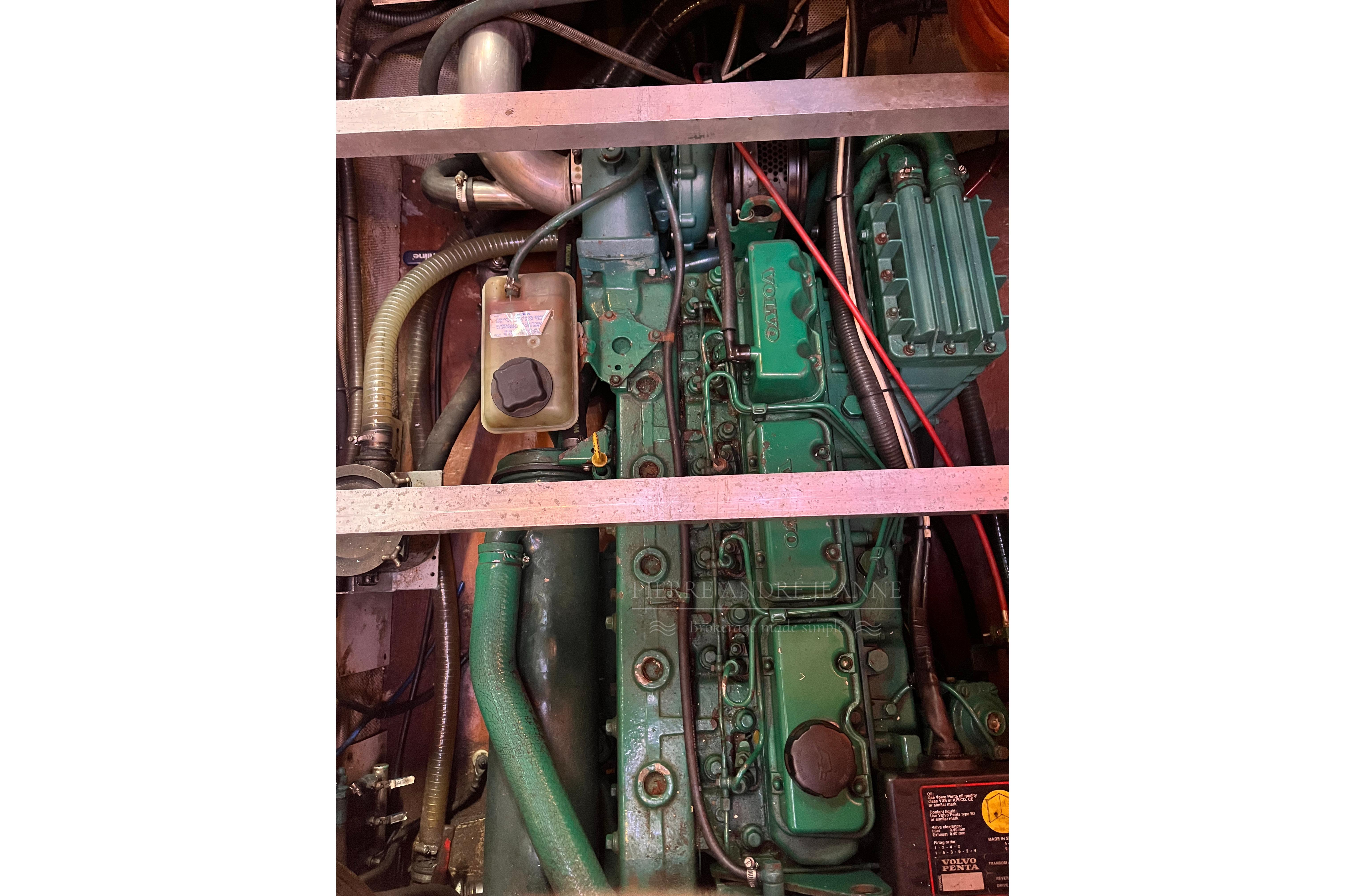 Engine compartment of a 1975 Nautor Swan 65 yacht, featuring a green Volvo engine.