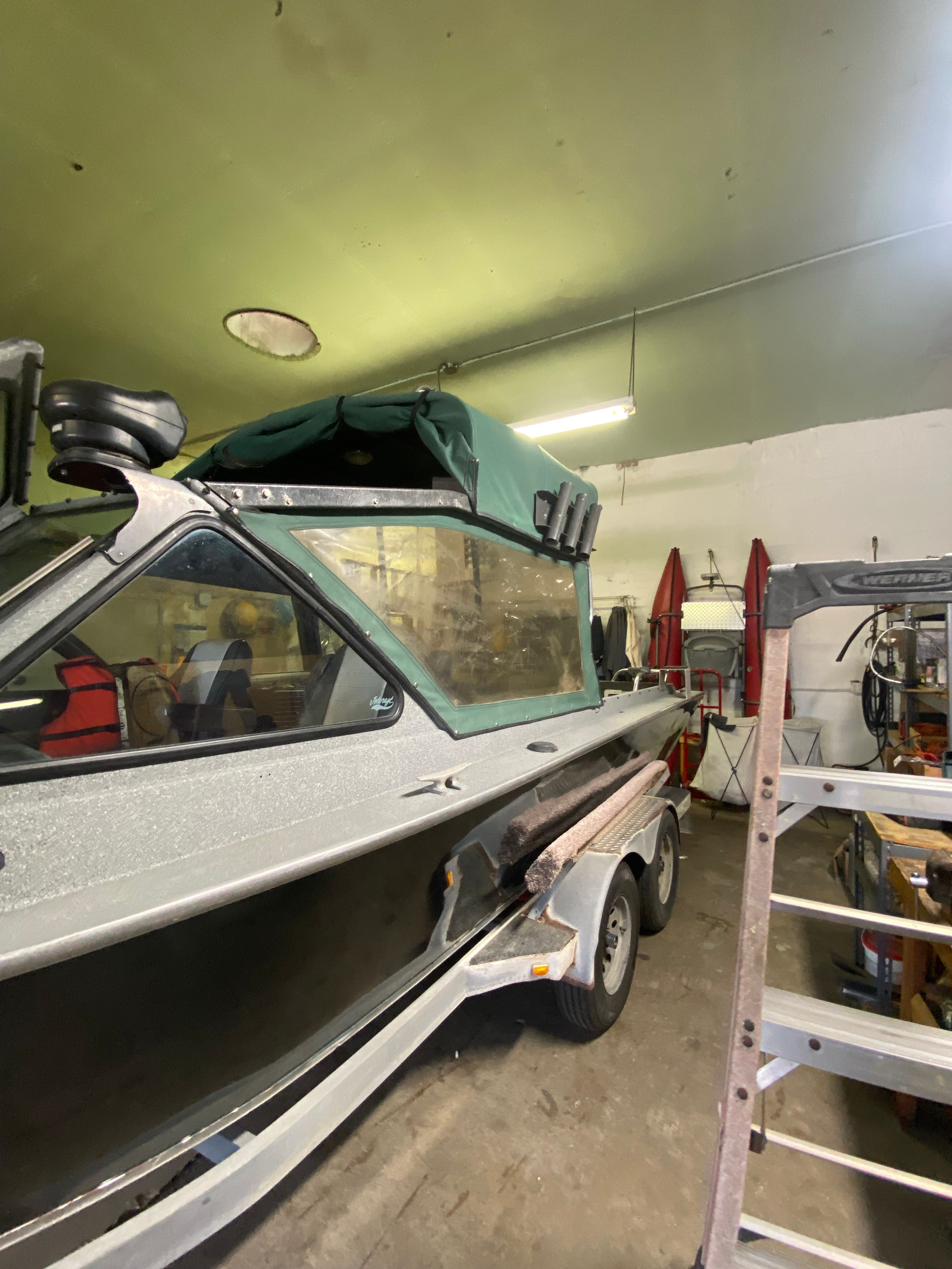 1993 Jetcraft Fastwater boat in a workshop.