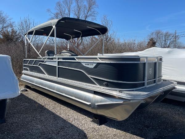 2025 Armada Saphir 23CR pontoon boat with canopy, parked outdoors.
