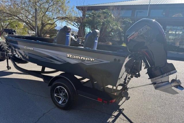 2026 Ranger VS1782SC Angler boat with motor, parked outdoors.