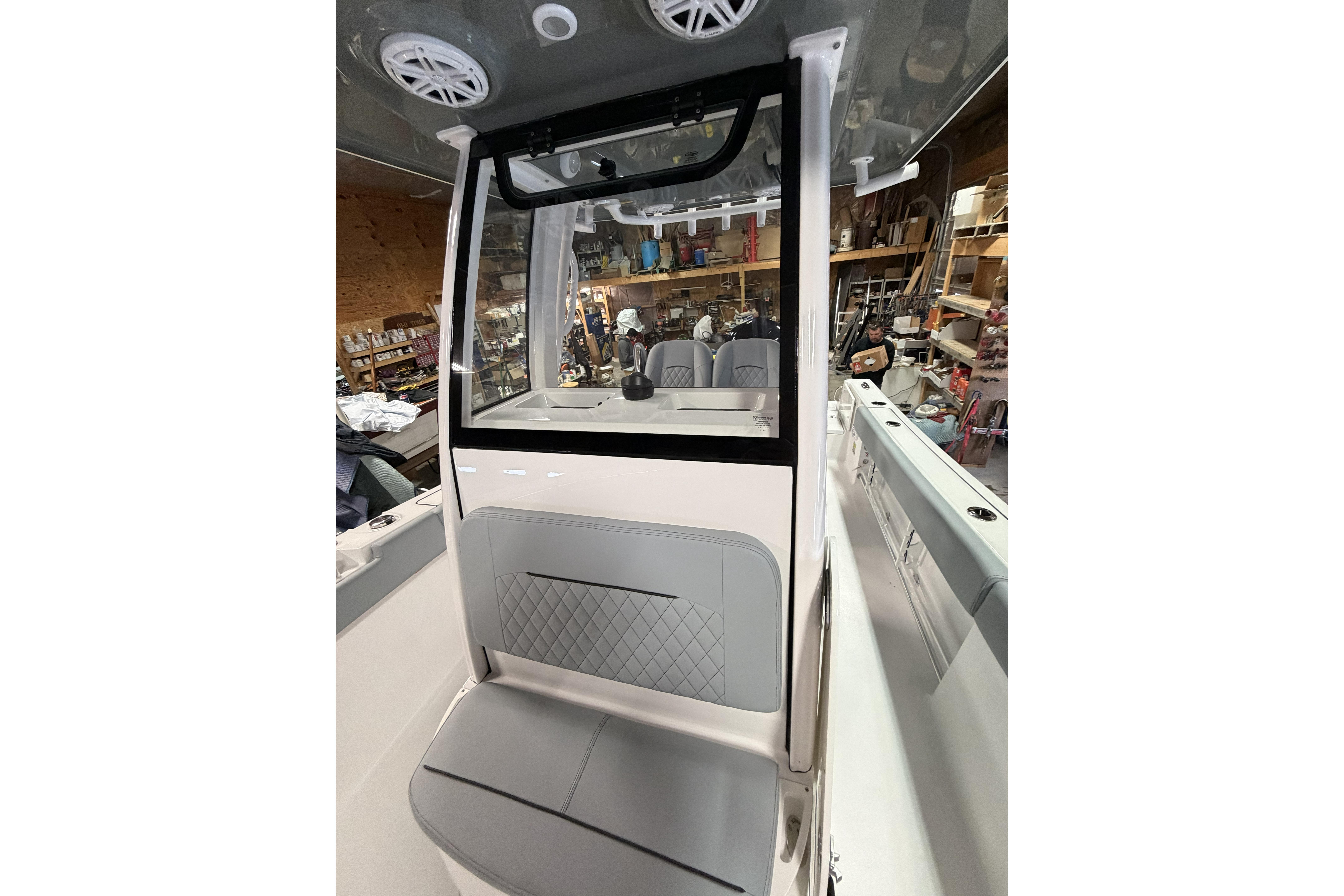 2026 Sportsman Open 232 Center Console interior with seating and storage features.