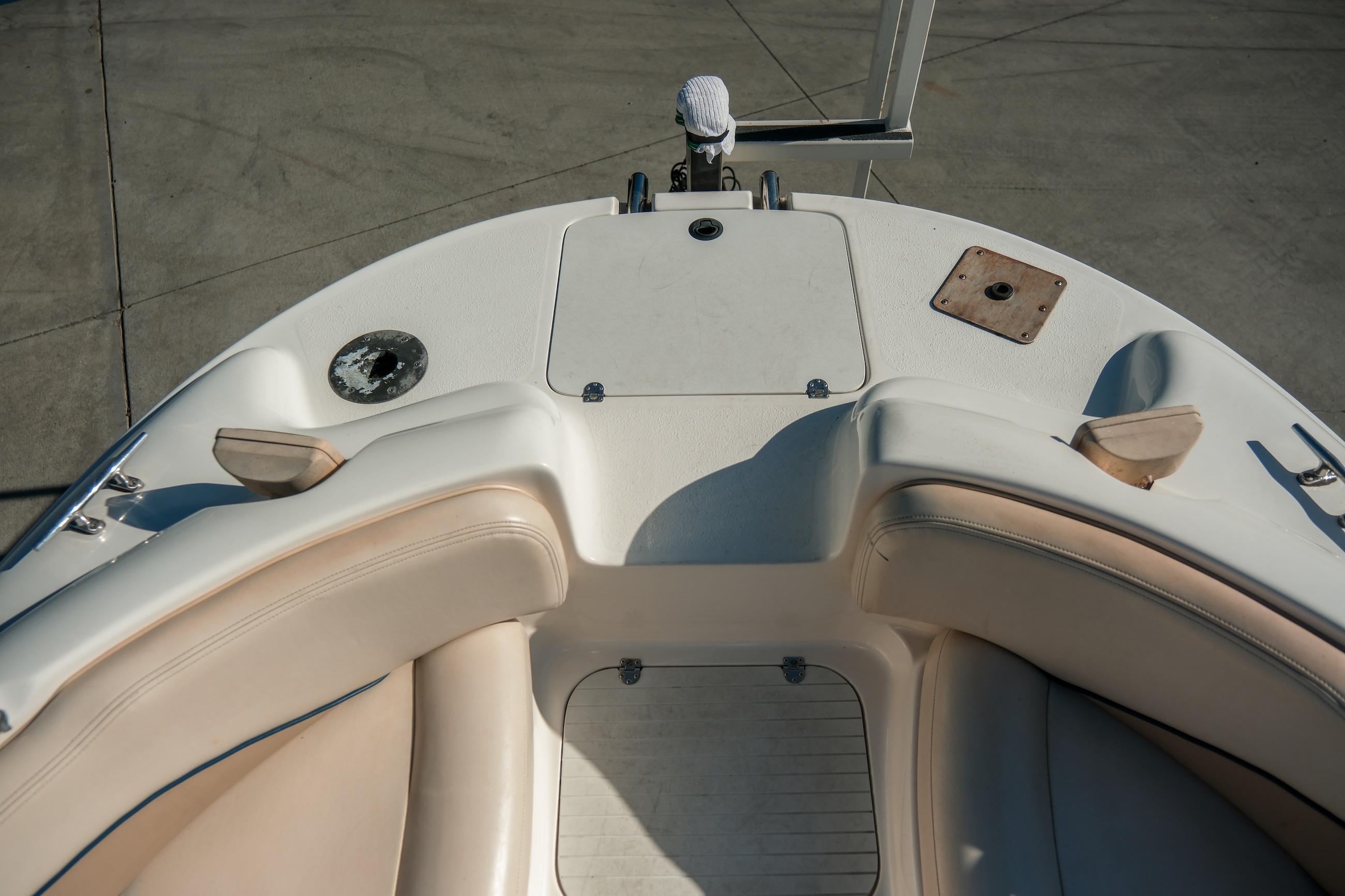 1998 Chaparral 232 Sunesta boat interior with beige seating and deck details.