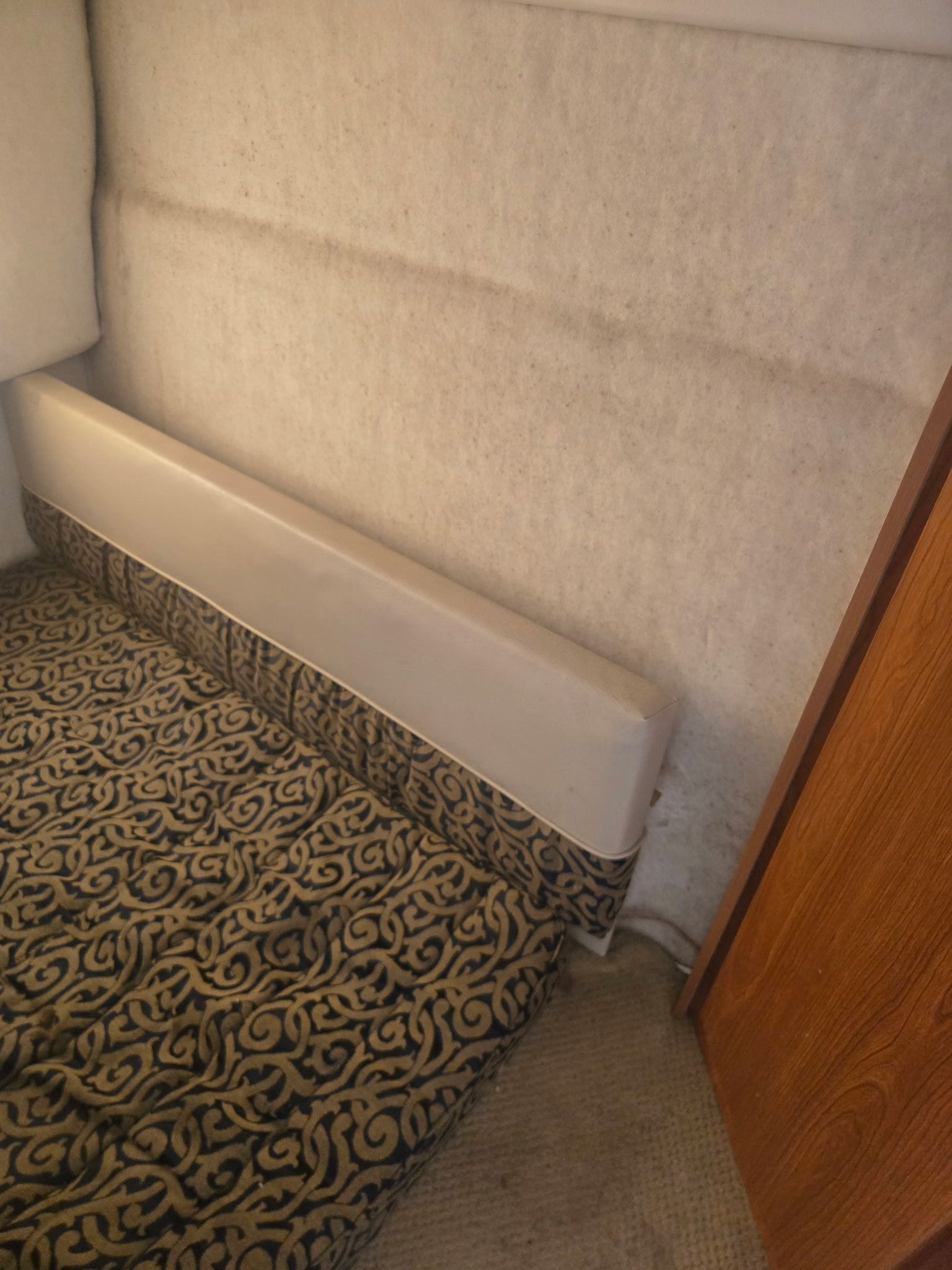 Interior of a 2003 Bayliner 28 with patterned upholstery.