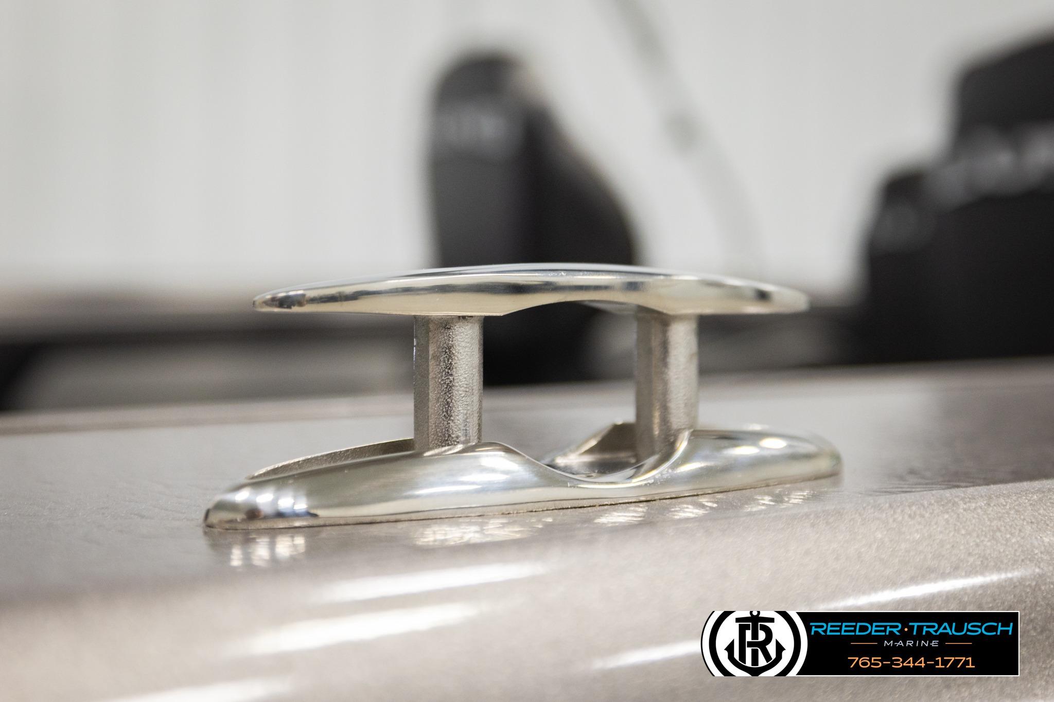 Close-up of a cleat on a 2026 Lund 1975 Tyee boat, Reeder-Trausch Marine logo visible.