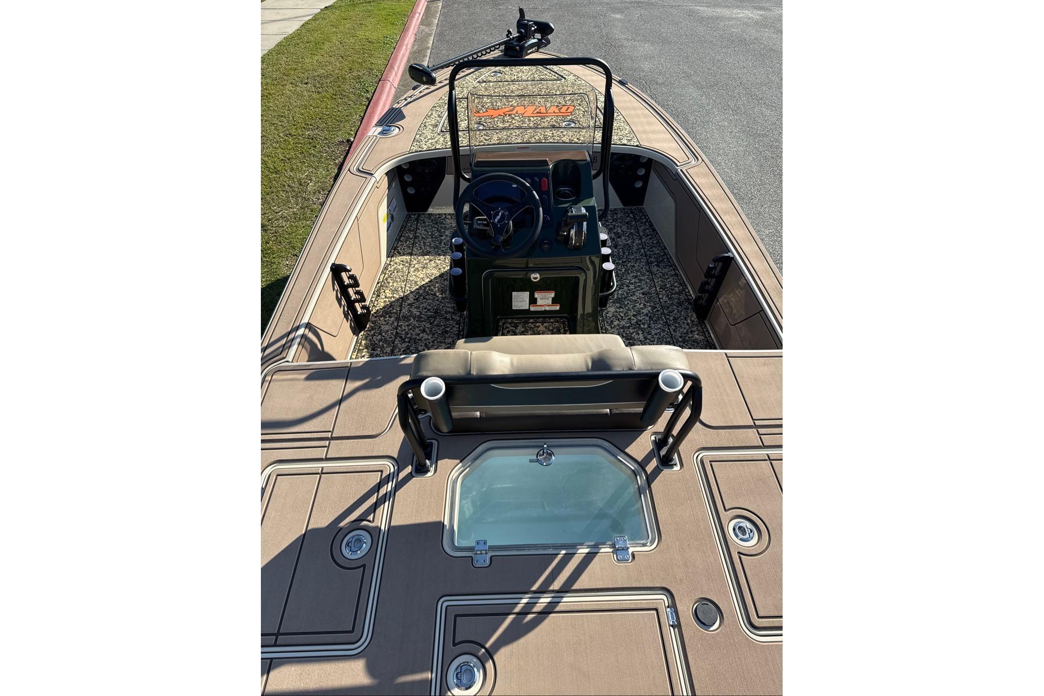 2026 Mako 18 Pro Skiff Backwater Edition boat interior with steering console and seating.