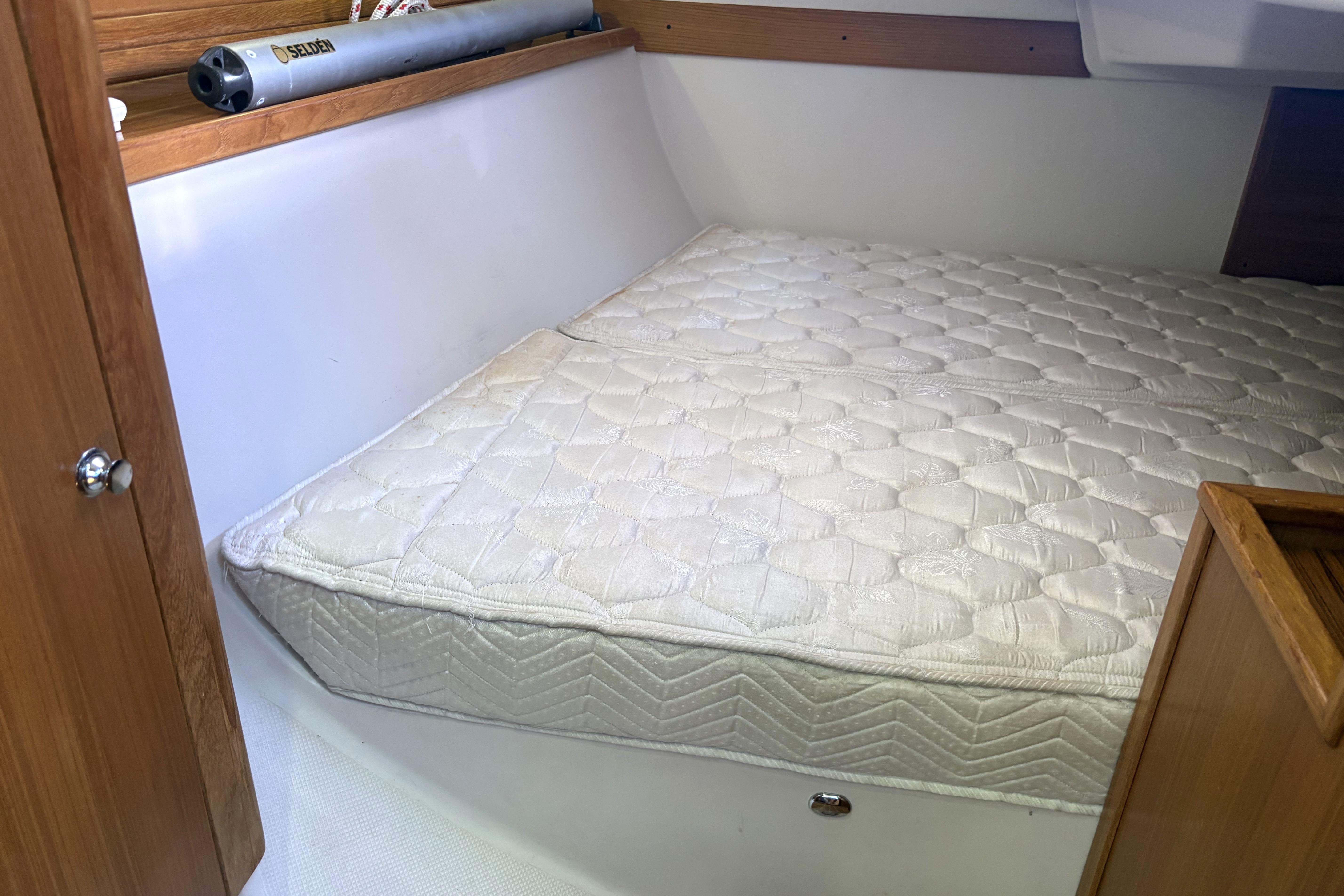 Interior cabin of 2011 Catalina 355 sailboat with a comfortable mattress.