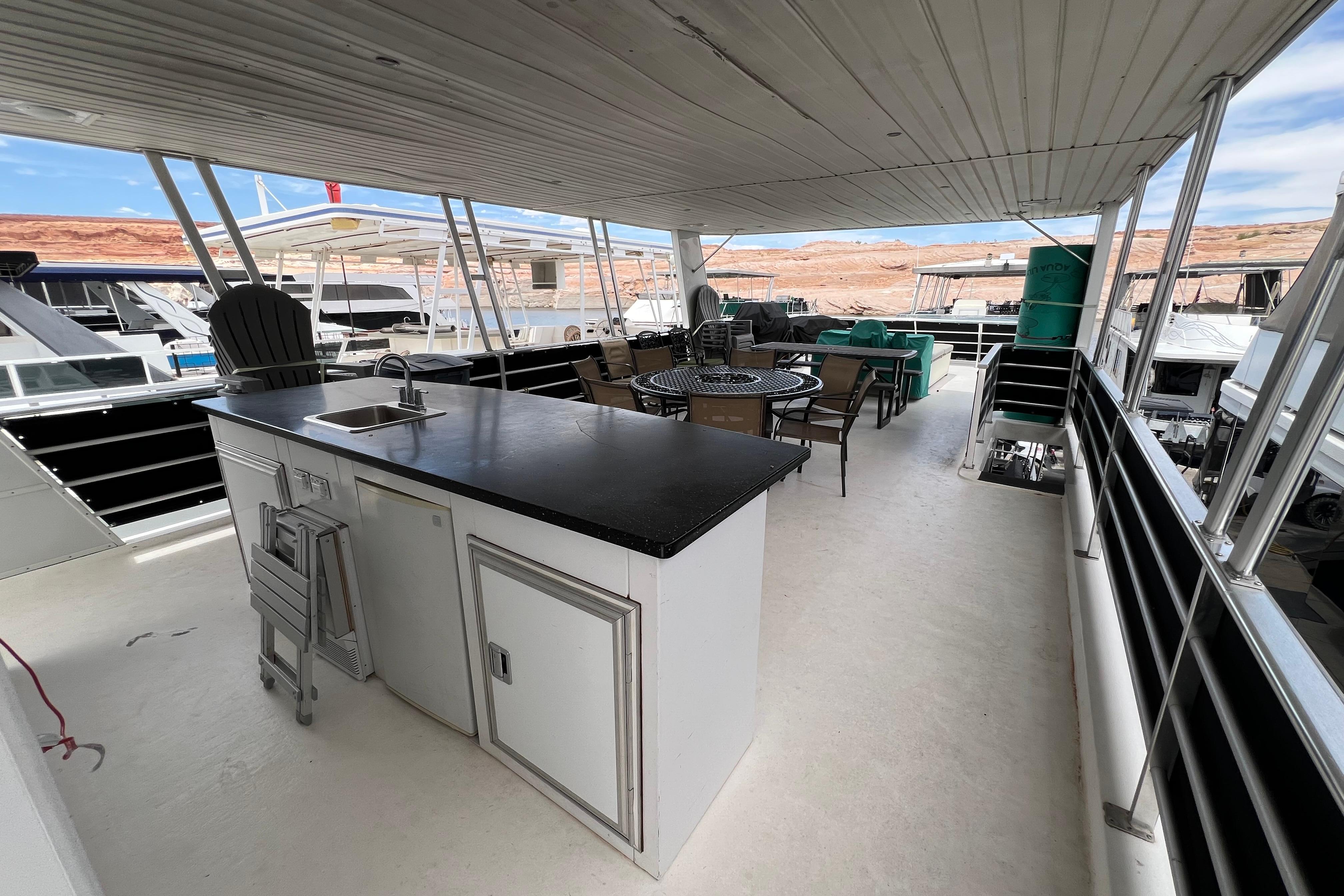 Spacious deck of 2013 Destination Yacht Lotta Yachta with seating and kitchenette.