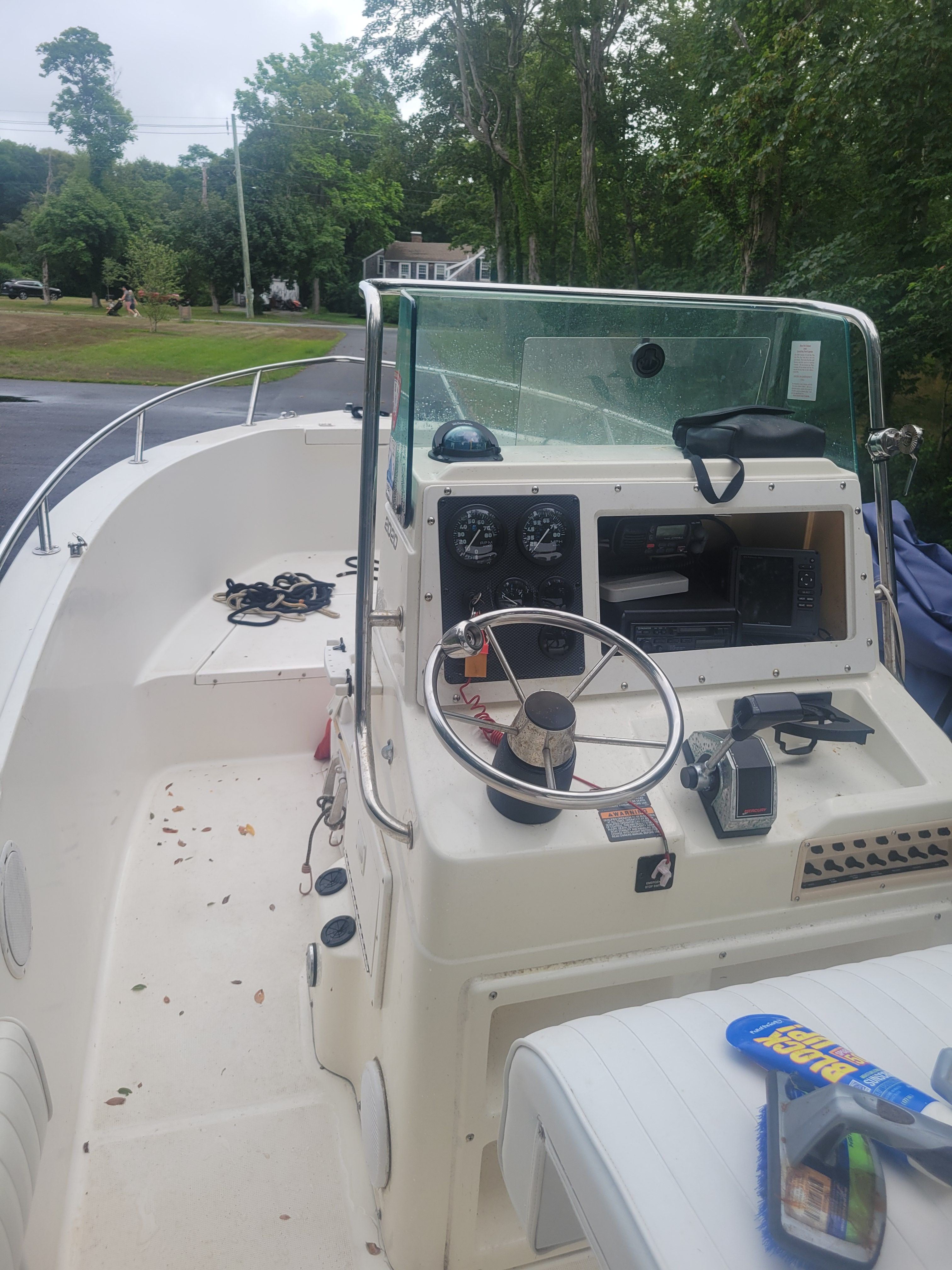 Robalo 2020 Center Console boat, 2001 model, with steering wheel and control panel, docked outdoors.