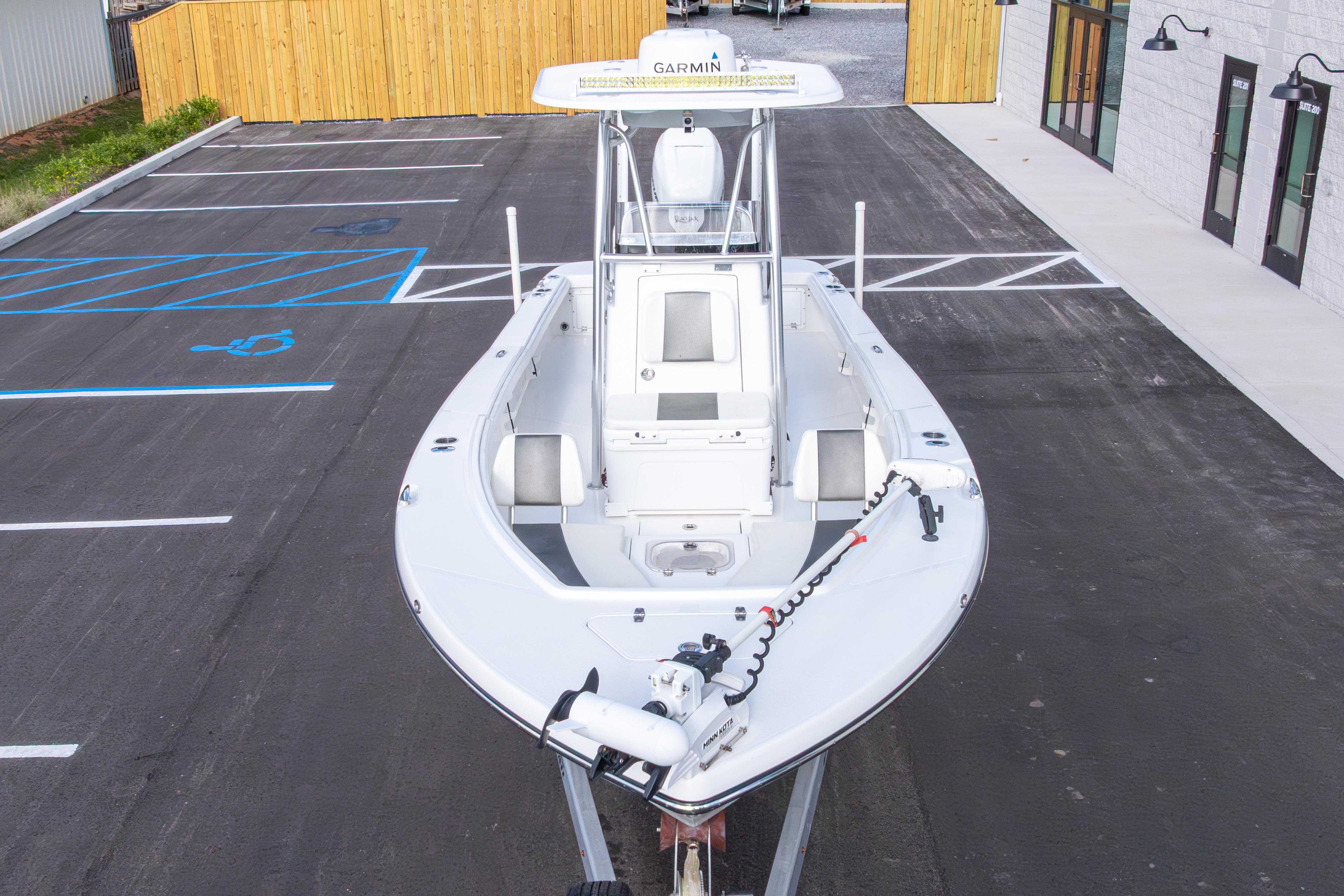2022 BlackJack 256 Coastal boat in parking lot, featuring Garmin equipment.