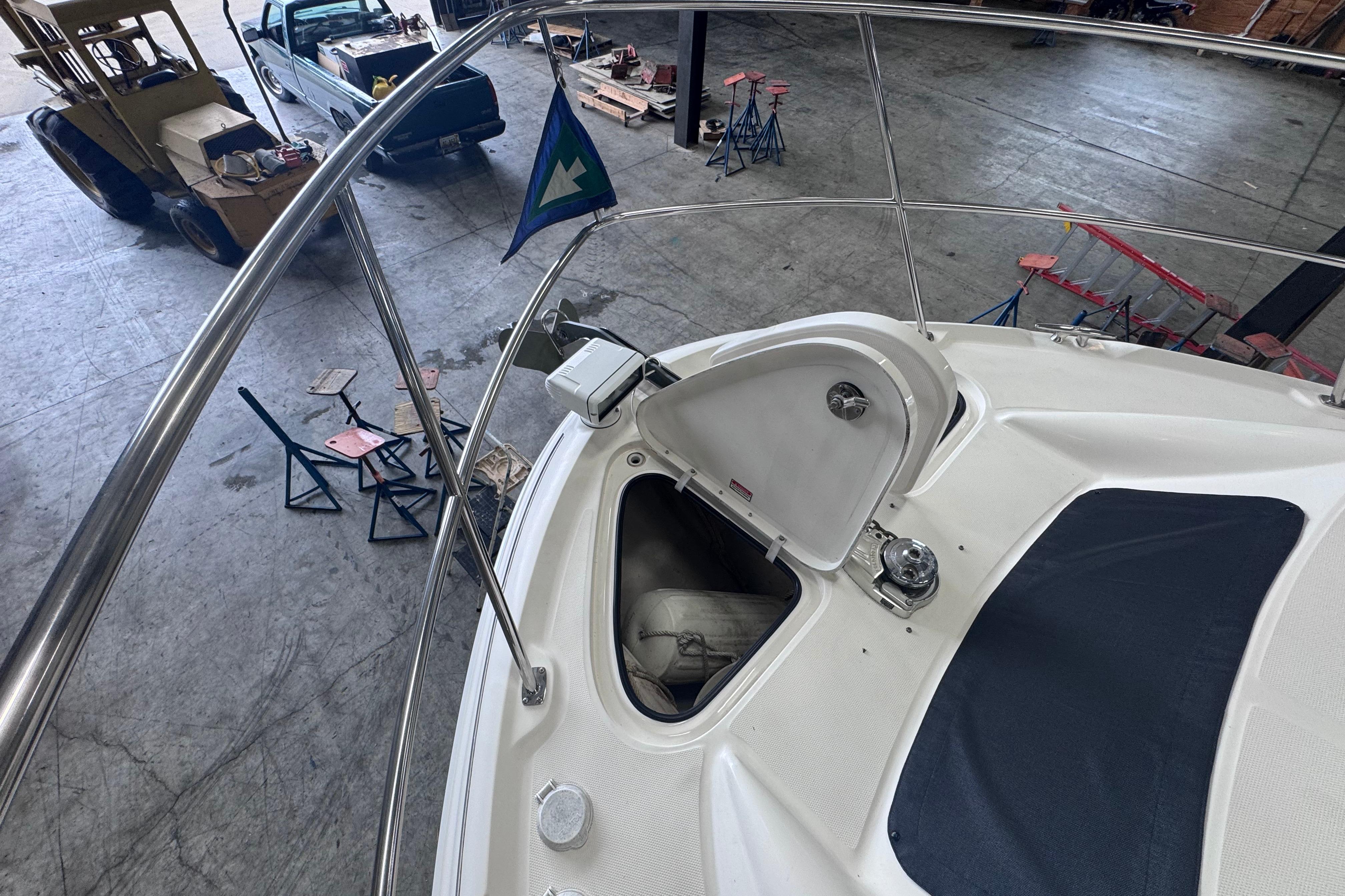 2004 Sea Ray 390 Motor Yacht in a workshop, open hatch, and visible equipment.