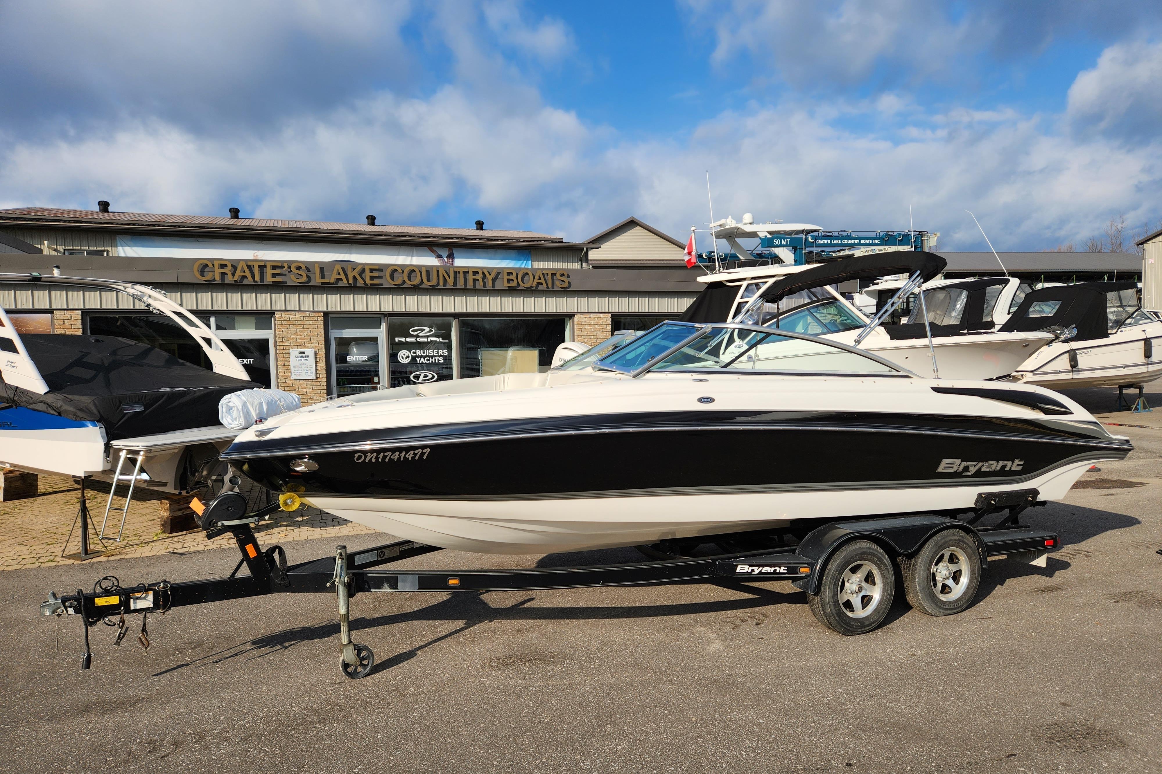 2009 Bryant 233 boat on trailer at Crate's Lake Country Boats dealership.