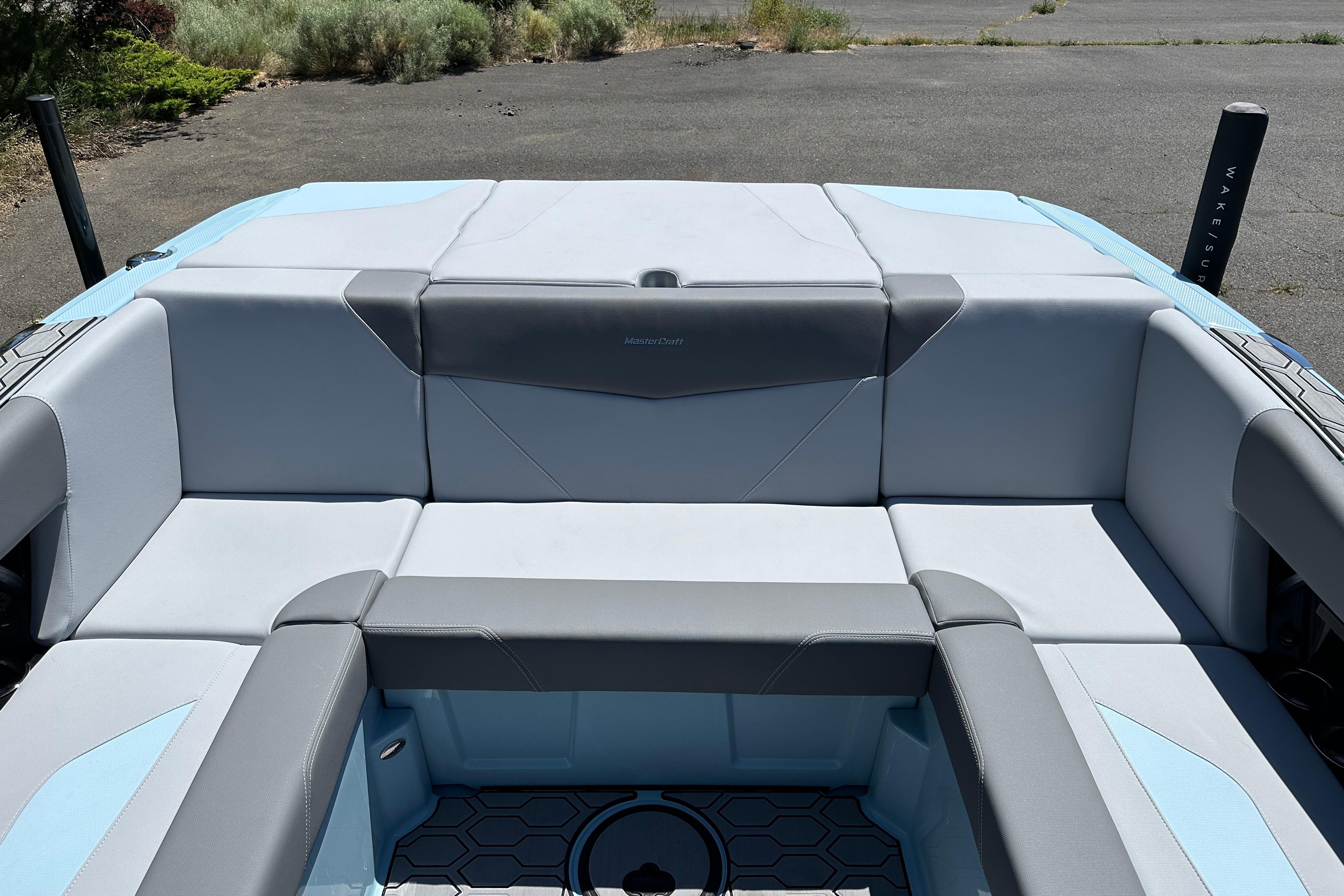 2023 MasterCraft NXT23 boat interior with gray and blue seating.