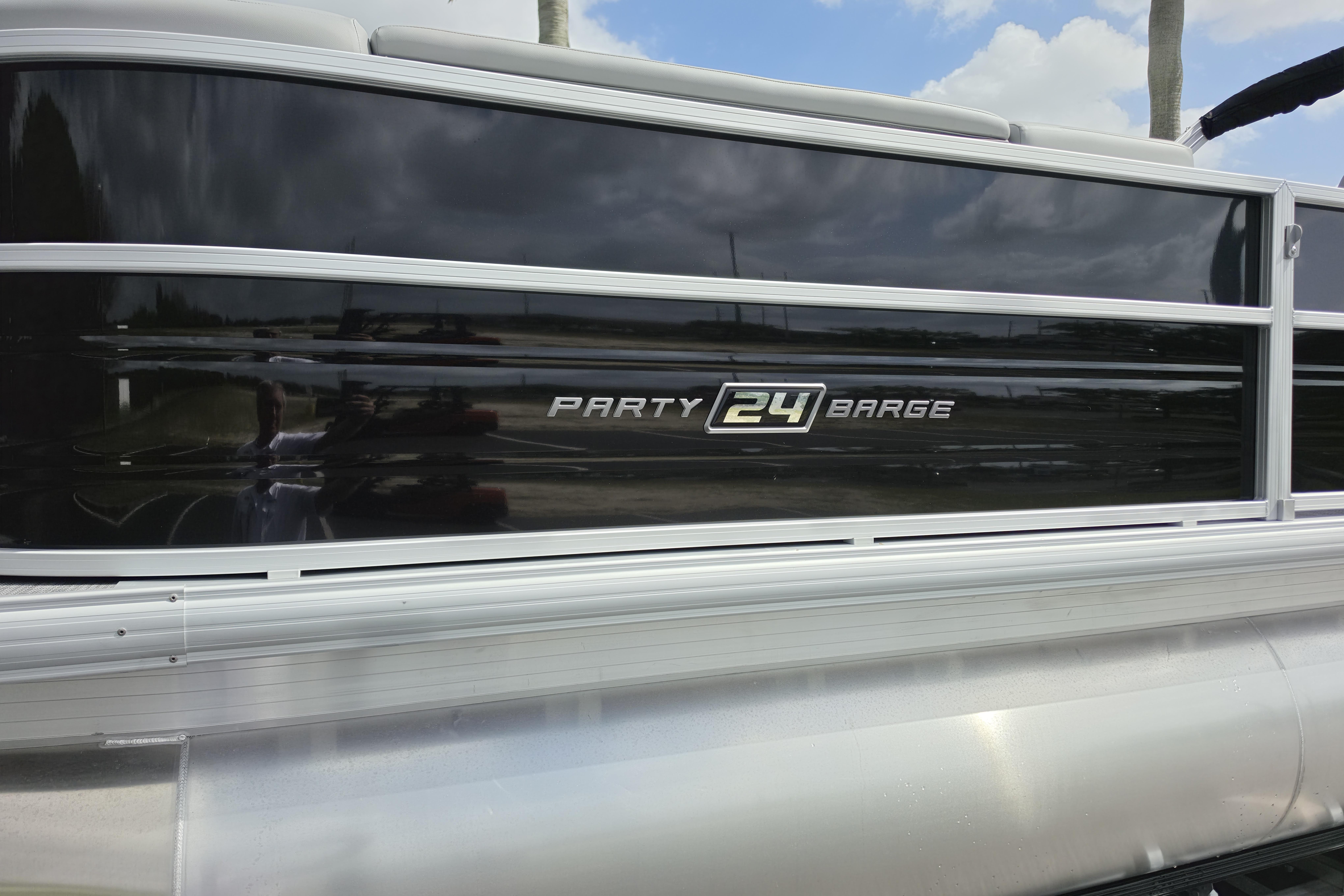 2026 Sun Tracker Party Barge 24 XP3 pontoon boat with sleek black exterior.