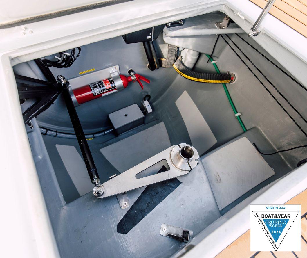 Vision 444 boat interior, 2025 model, featuring a fire extinguisher and mechanical components.