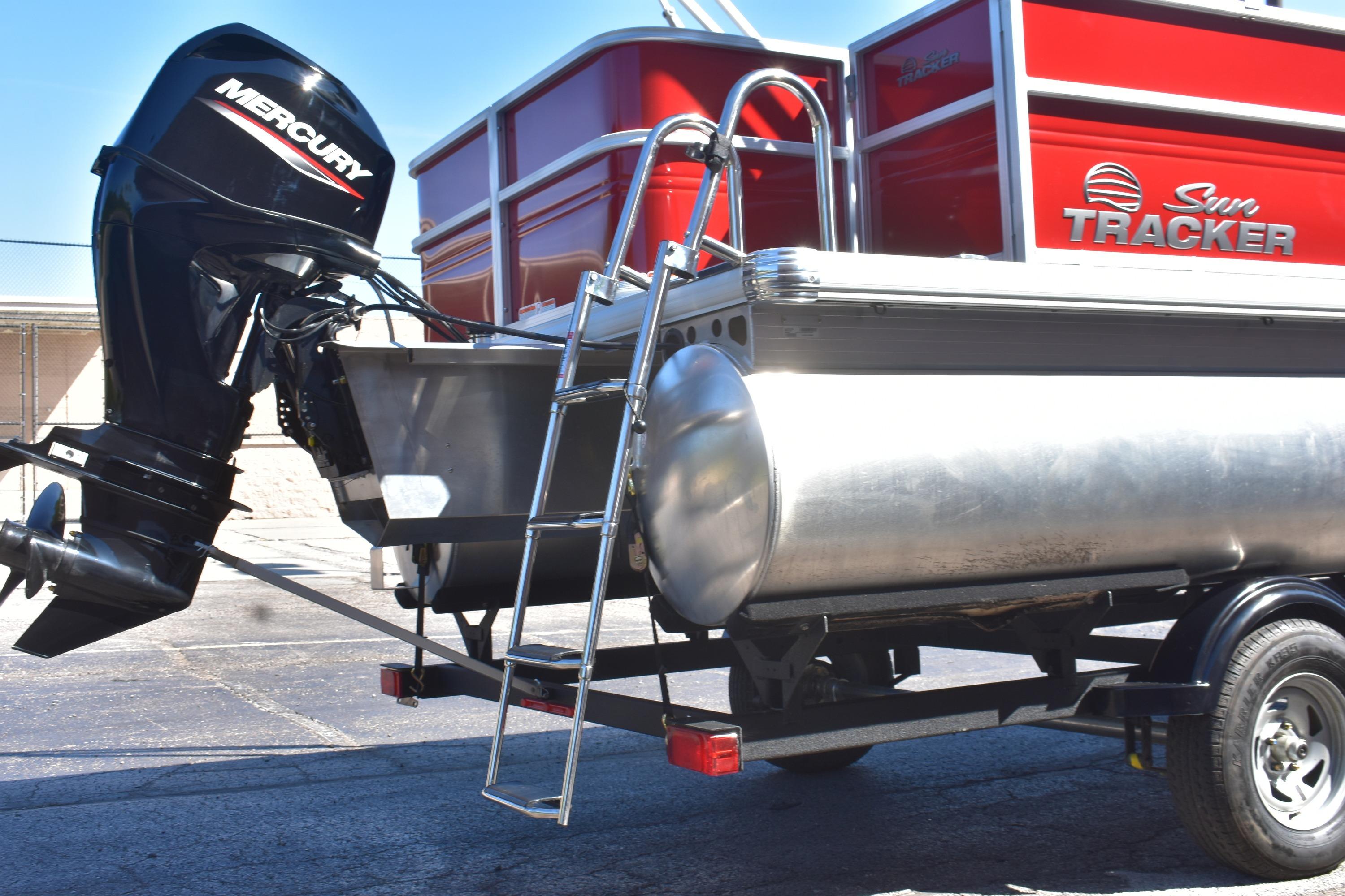 2026 Sun Tracker Party Barge 18 DLX with Mercury outboard motor and ladder.