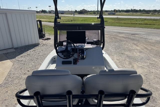 2025 Majek 24 Reaper boat interior with dual seats and steering console.