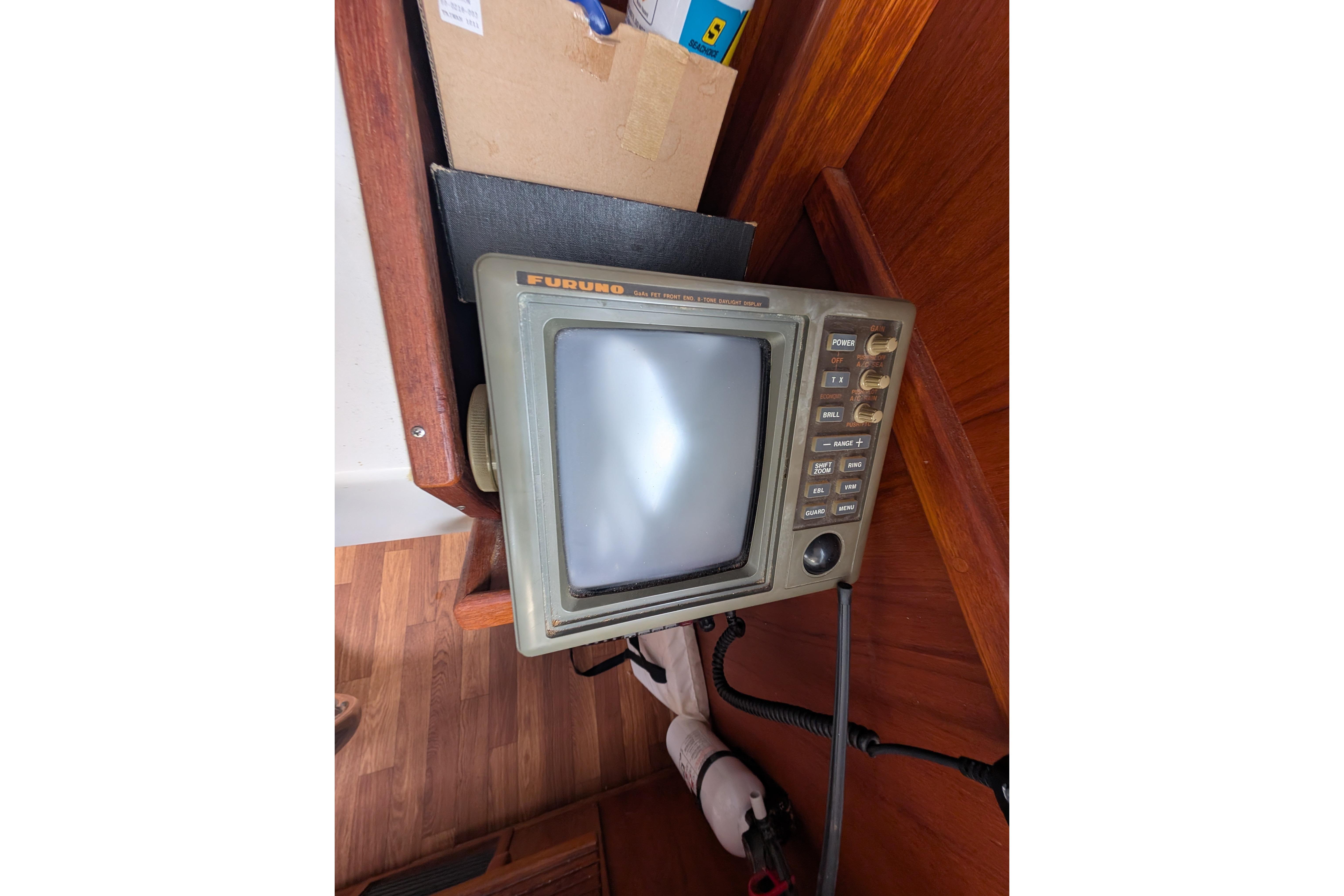 Vintage Furuno radar display on a 1998 Markley 46 boat interior.