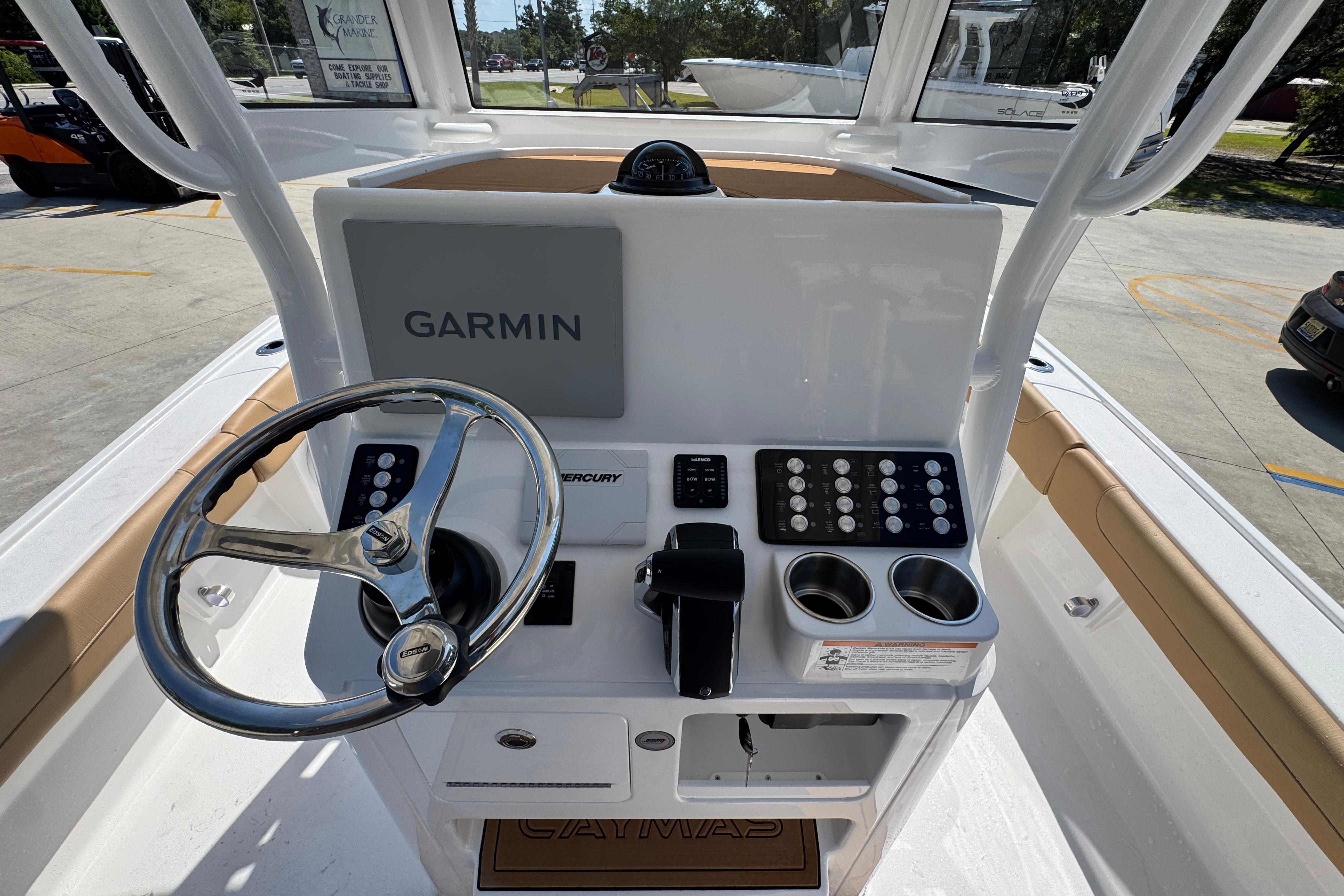 2027 Caymas 26 HB boat console with Garmin display and steering wheel.