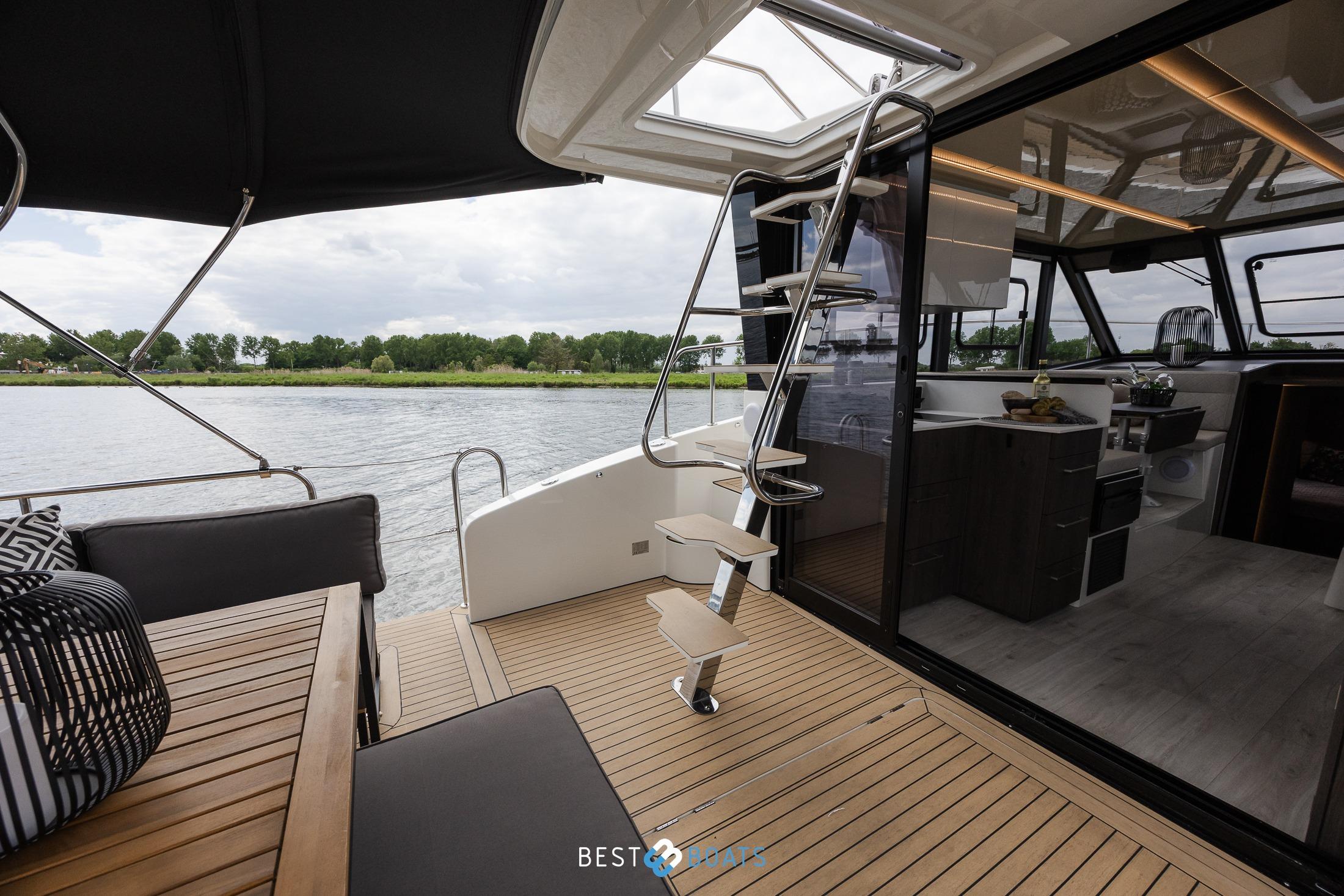 2023 Cobra Yachts Futura 36 Premium Fly, elegant interior with river view.