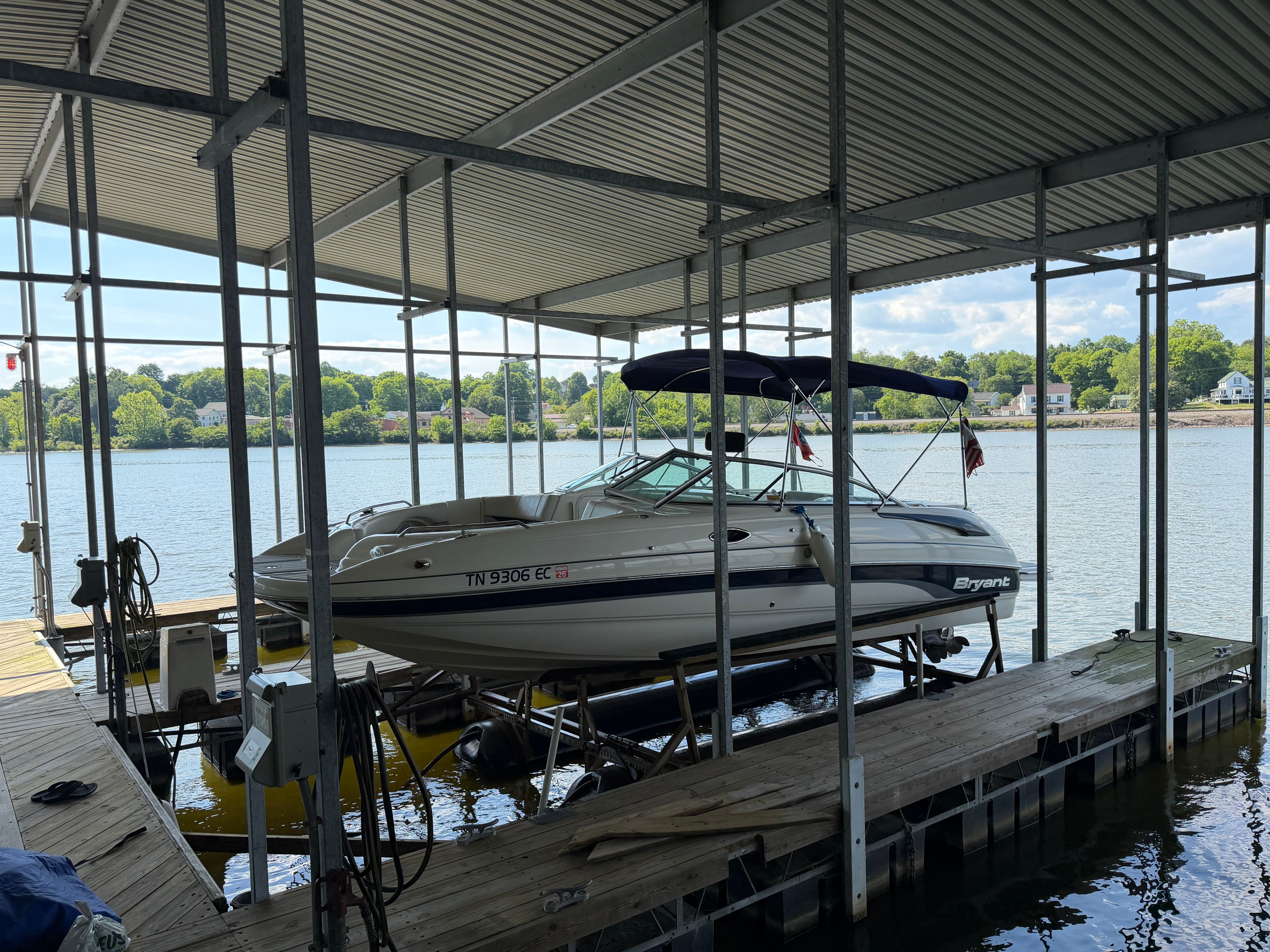 2010 Bryant 255 boat in covered dock by the lake.