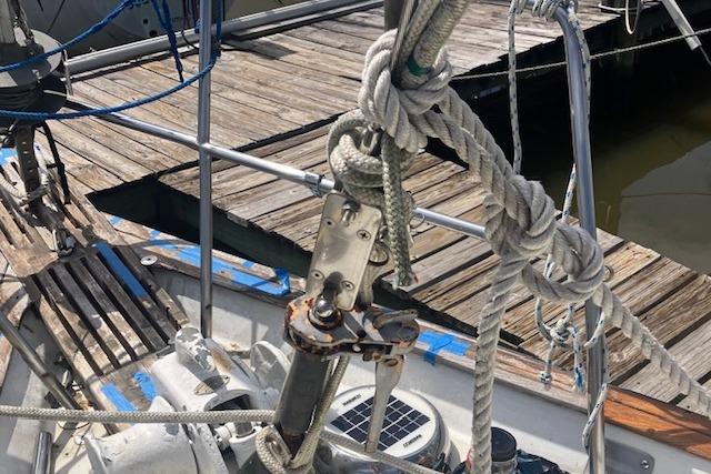 1979 Pearson 365 Ketch sailboat deck with ropes and dock in view.