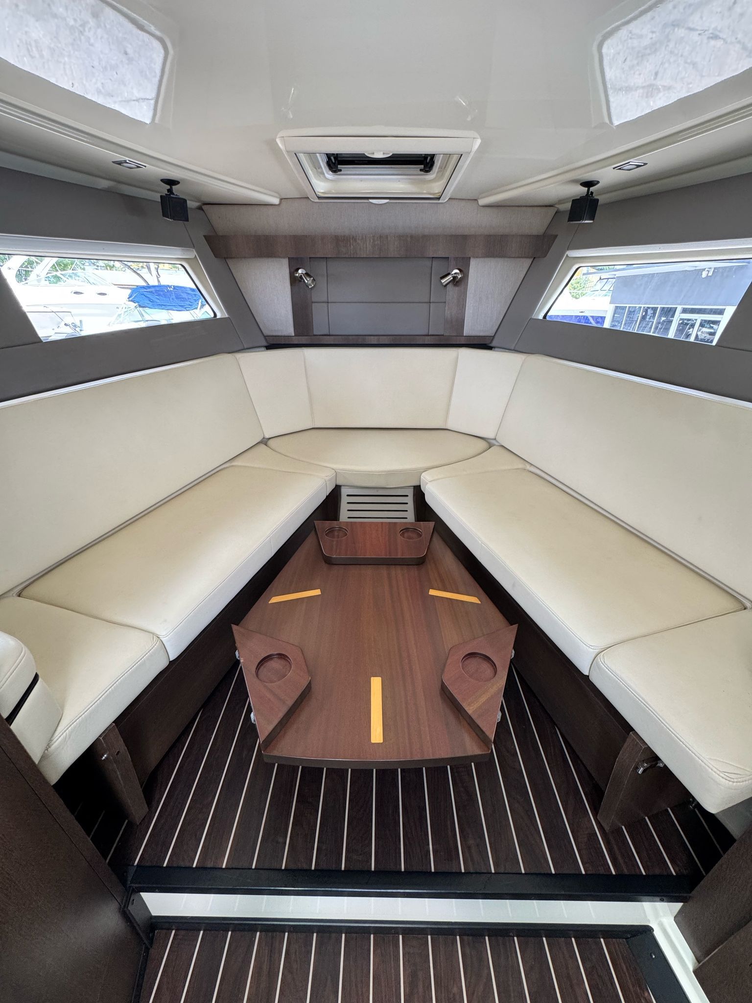 Interior of 2015 Monterey 360 Sport Coupe with elegant seating arrangement.