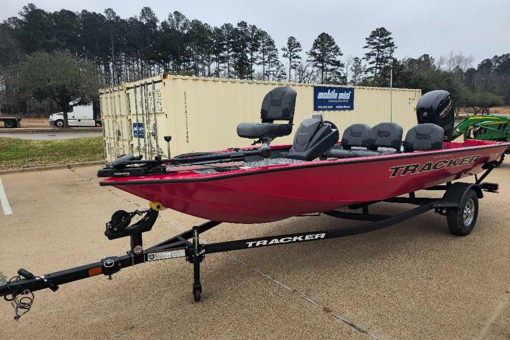2026 Tracker Pro Team 175 Crappie Edition boat on trailer, parked outdoors.