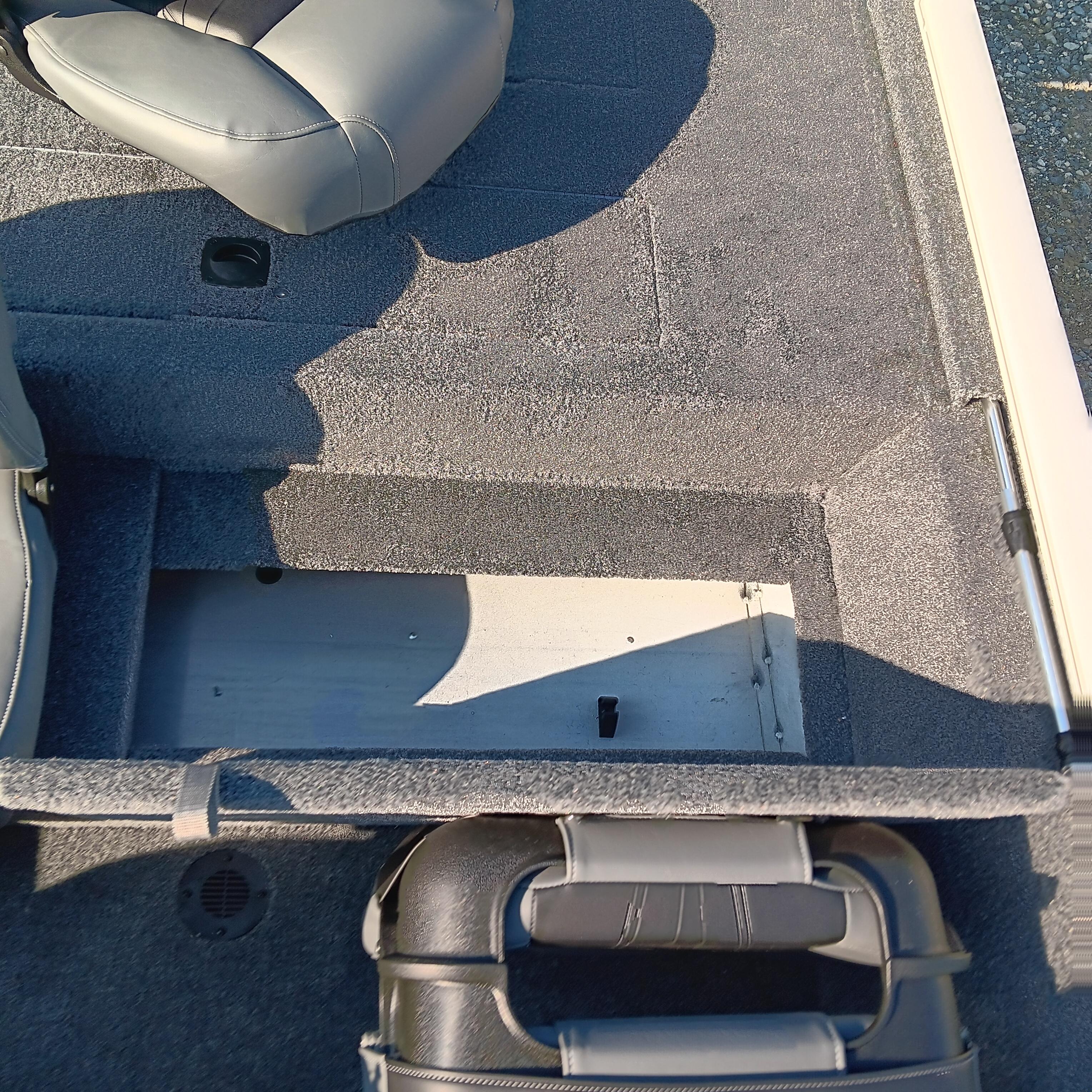 Interior of 2026 Tracker Bass Tracker Classic XL boat showing seating and storage area.