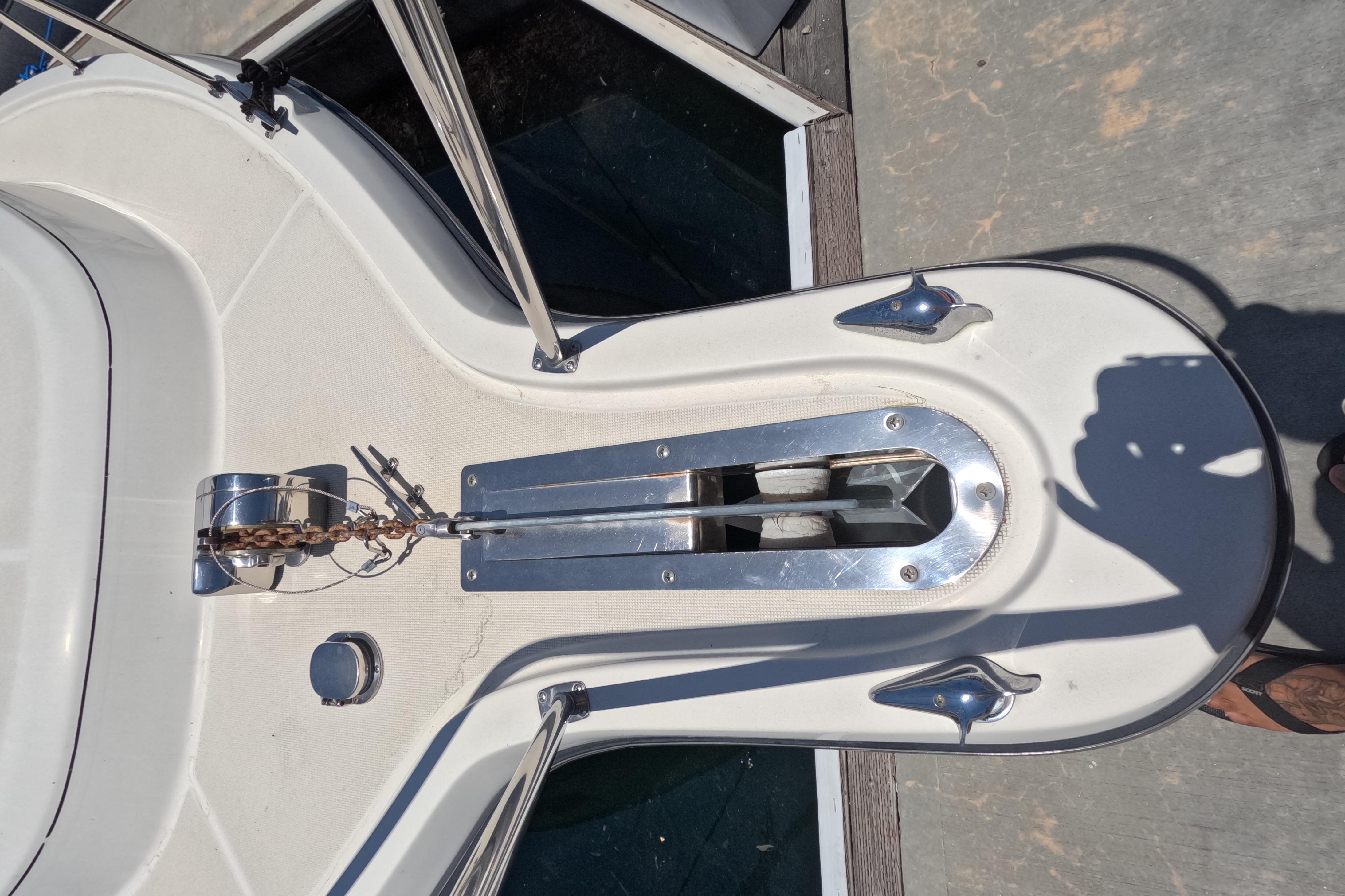 Bow of a 1995 Tiara Yachts 2900 Open with anchor chain and fittings.
