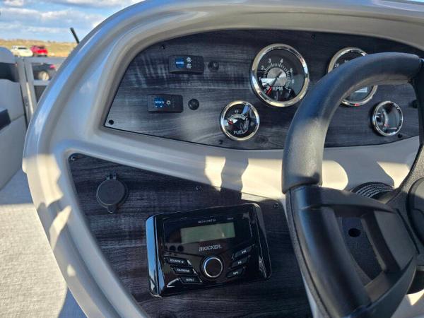 Dashboard of 2025 Berkshire 20 CL boat with steering wheel and control panel.