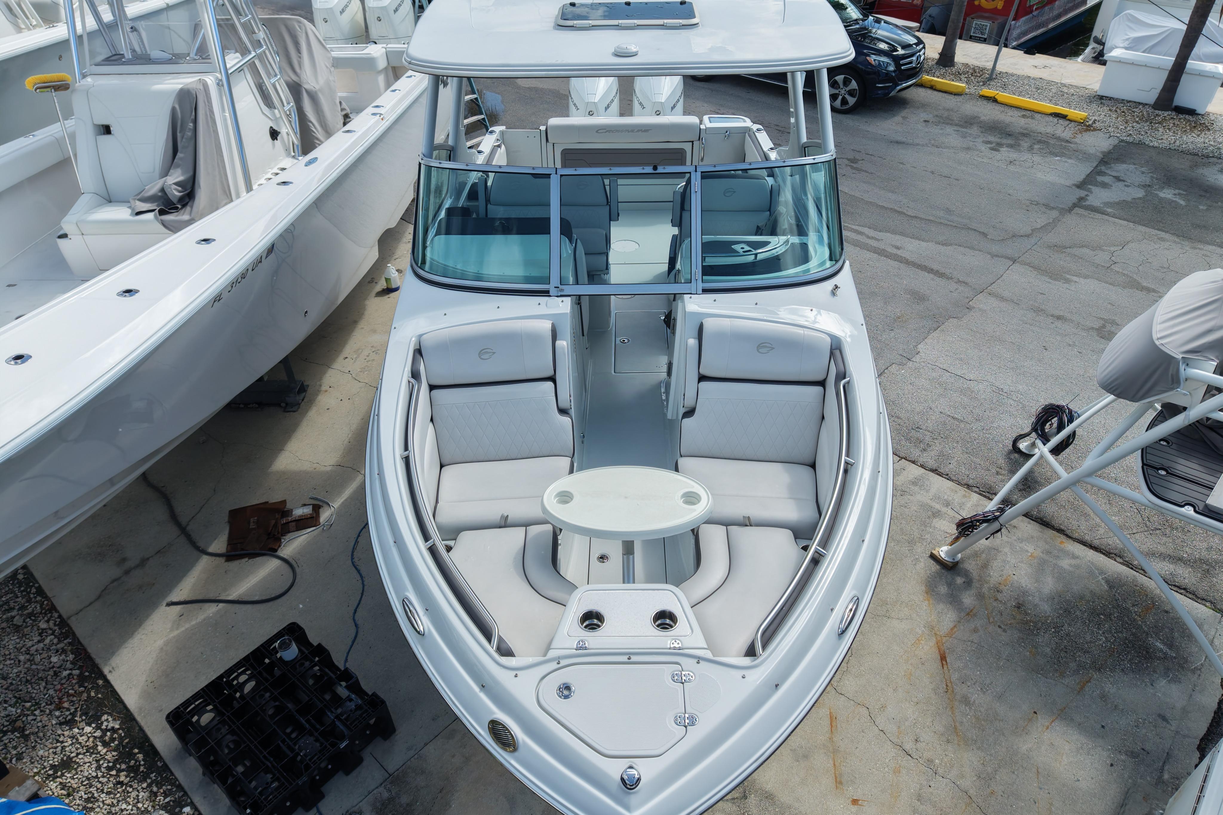 2024 Crownline 260 DC Finseeker boat with spacious seating and sleek design.