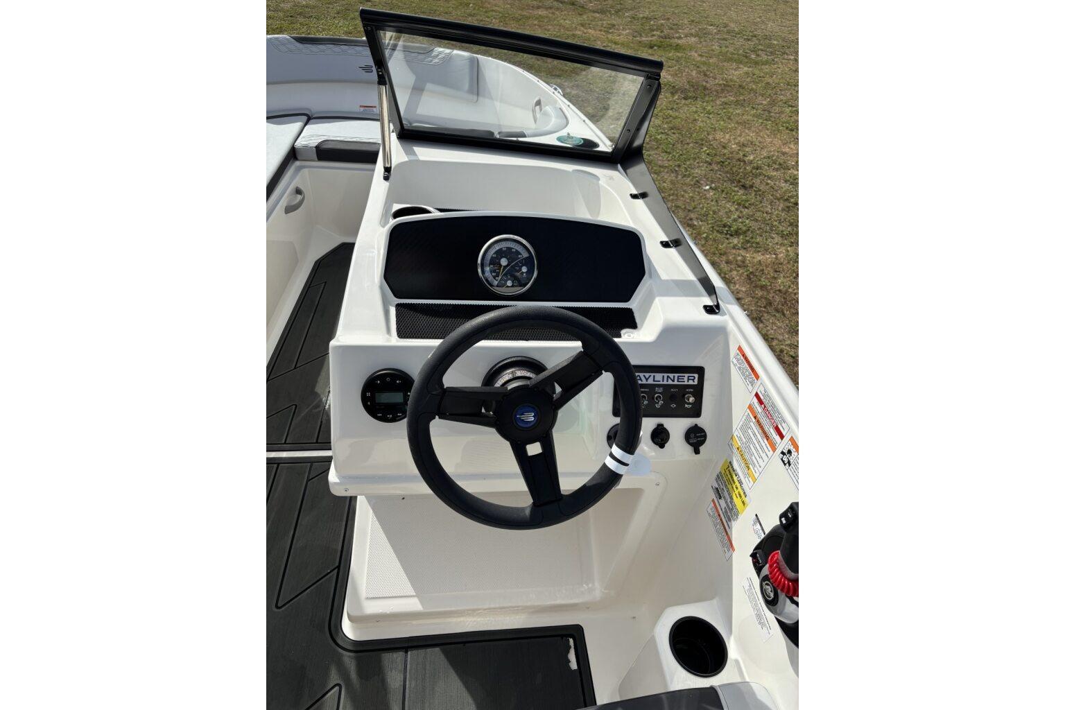 2025 Bayliner Element M17 boat dashboard with steering wheel and controls.