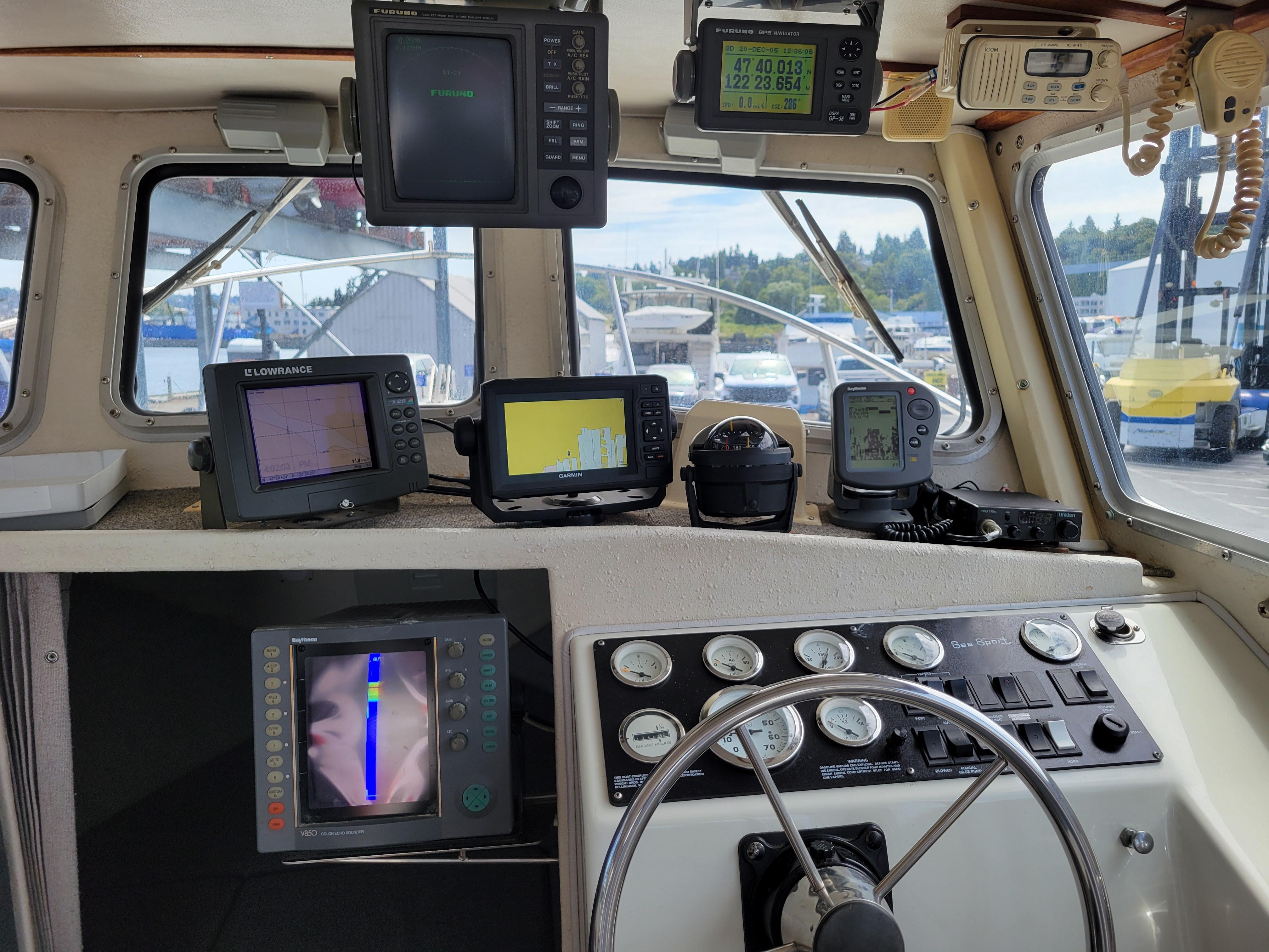1999 SeaSport 2400 XL Limited boat dashboard with navigation and control instruments.