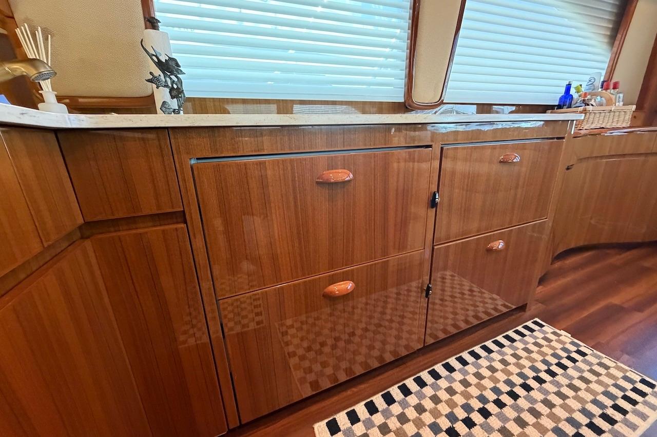 Luxurious wooden cabinetry in 2012 Viking 50 Convertible yacht interior.