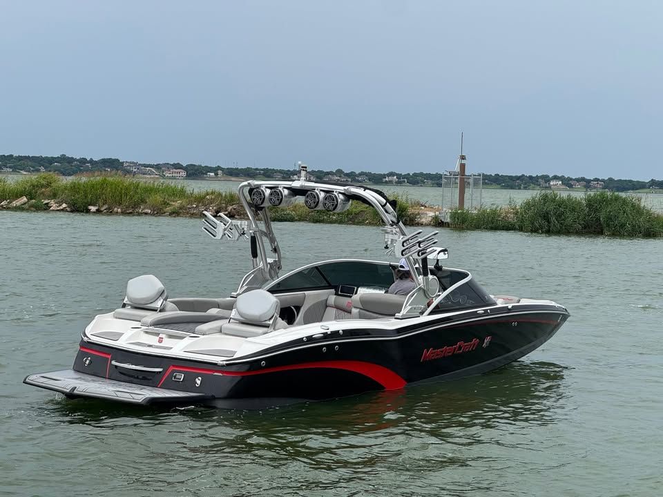 2015 MasterCraft X46 boat on calm water.
