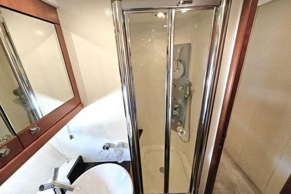 Luxurious bathroom with glass shower in 2005 Sunseeker Manhattan 66 yacht.