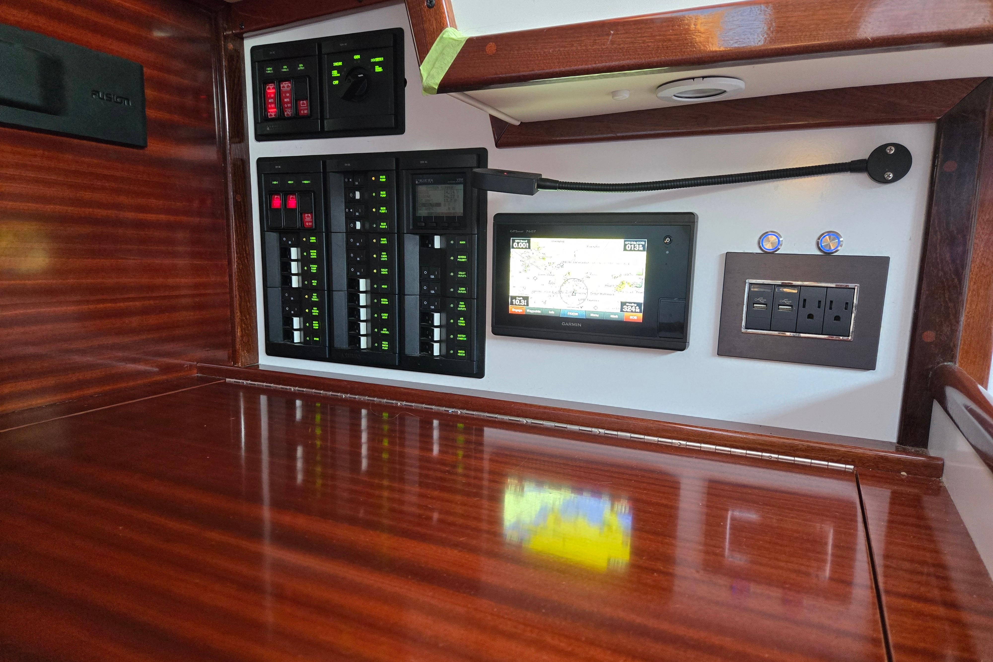 Hinckley Bermuda 40 yacht interior with navigation panel and control switches, 1970 model.