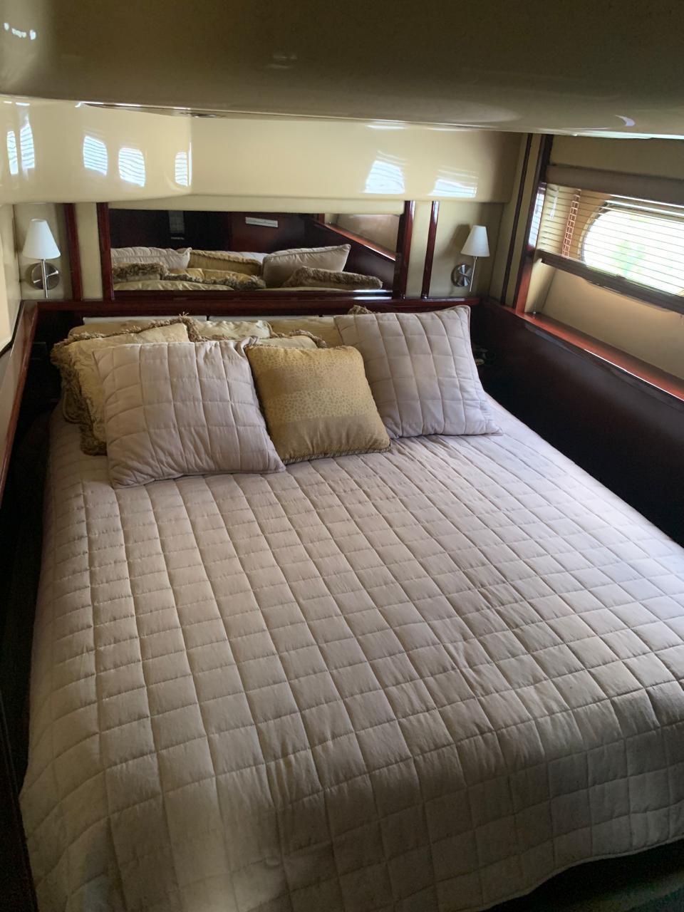 Luxurious bedroom interior of 2006 Sea Ray 52 Sedan Bridge yacht.
